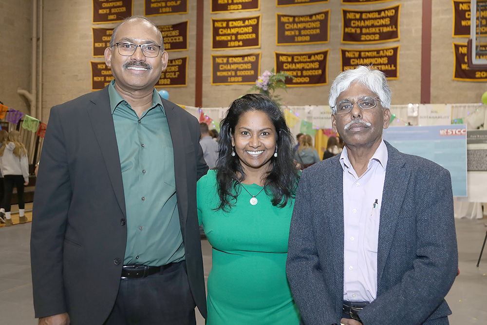 L to R- UMass Environmental Science Professor Timothy Randhir, Dr.Reena Randhir- STCC Department of Biological Sciences Assistant Professor, and UMass Professor of Sustainable Polymers Dr. Murugappan Muthukumar at the Sustainathon event taking place in the gym in building 2 at Springfield Technical Community College on April 11th. (Ed Cohen Photo) 