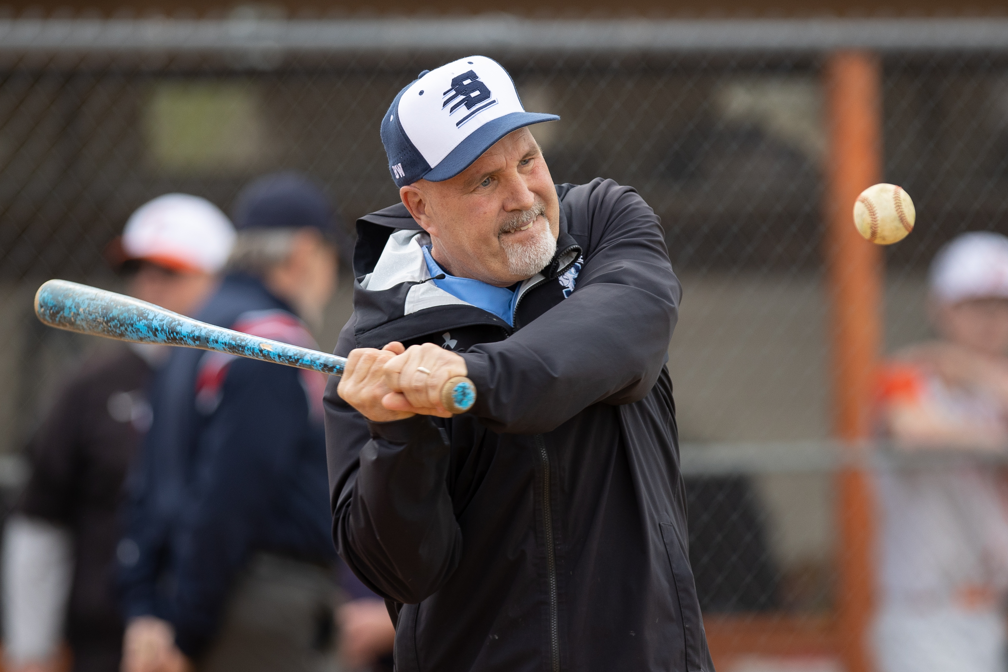 Head Coach Brian Anderson, of Shawnee, hits to players for warm ups in Marlton, NJ on Monday, April 3, 2023.