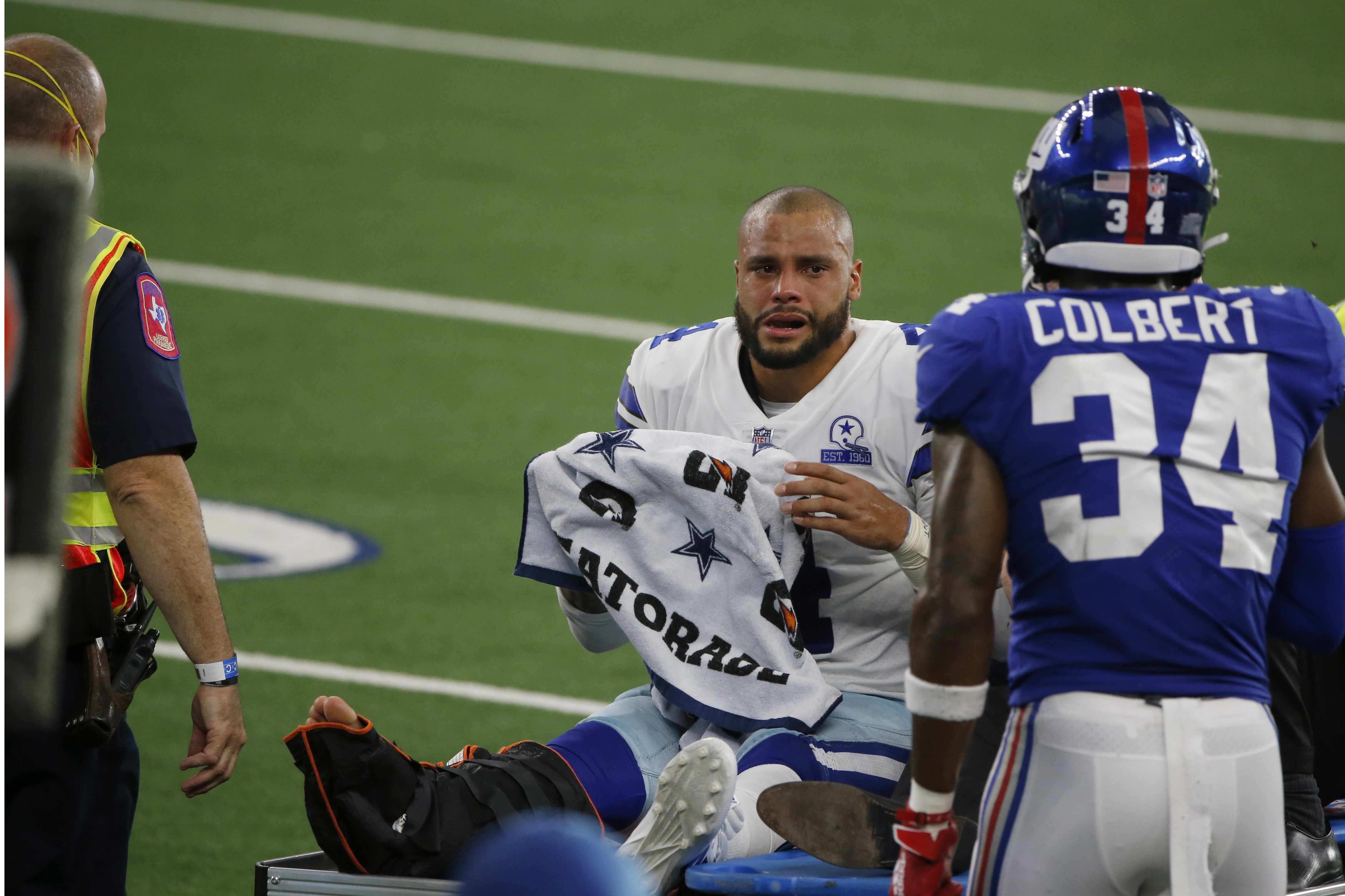 Dallas Cowboys quarterback Dak Prescott (4) in the huddle while on