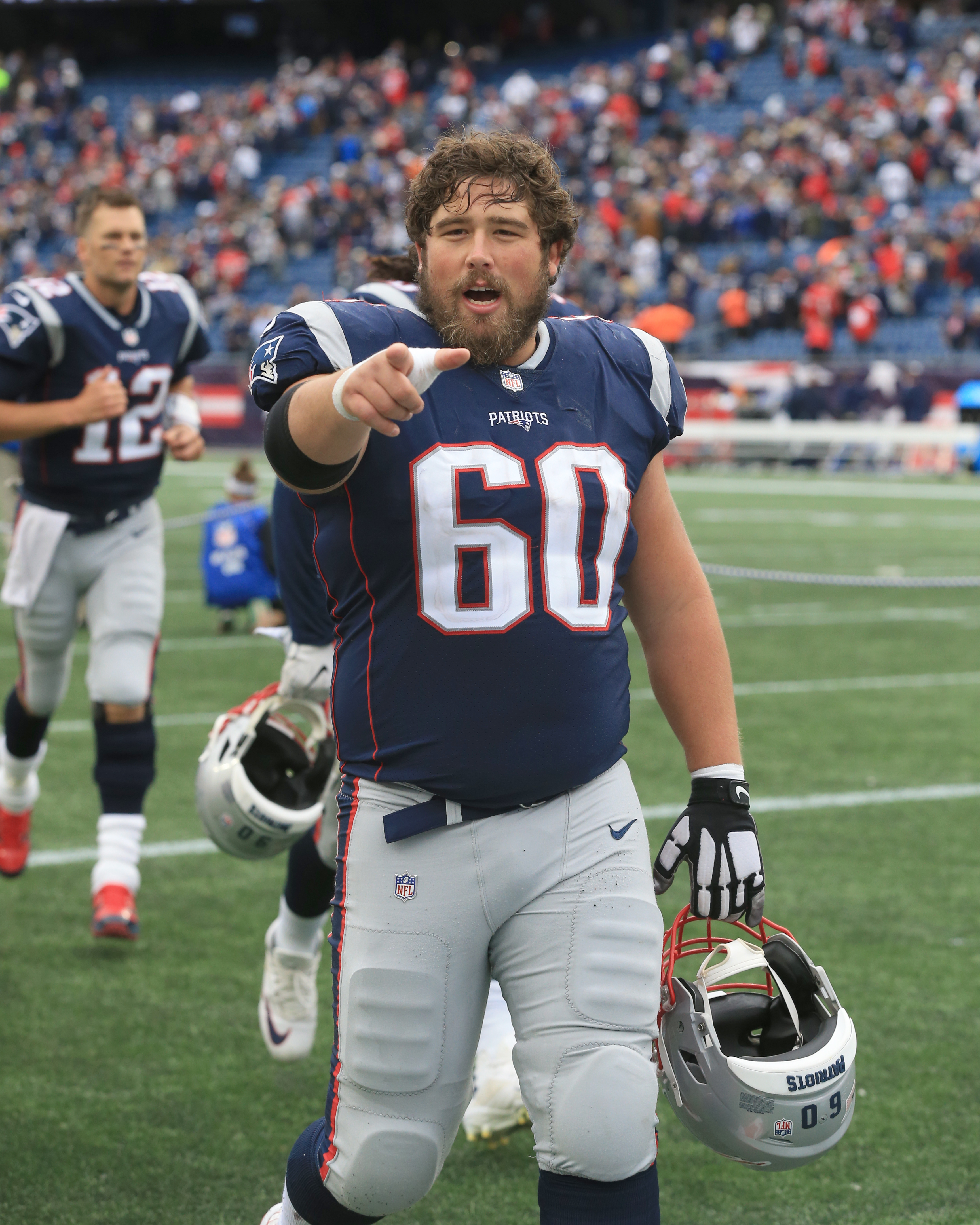 New England Patriots center David Andrews (60) walks off the field