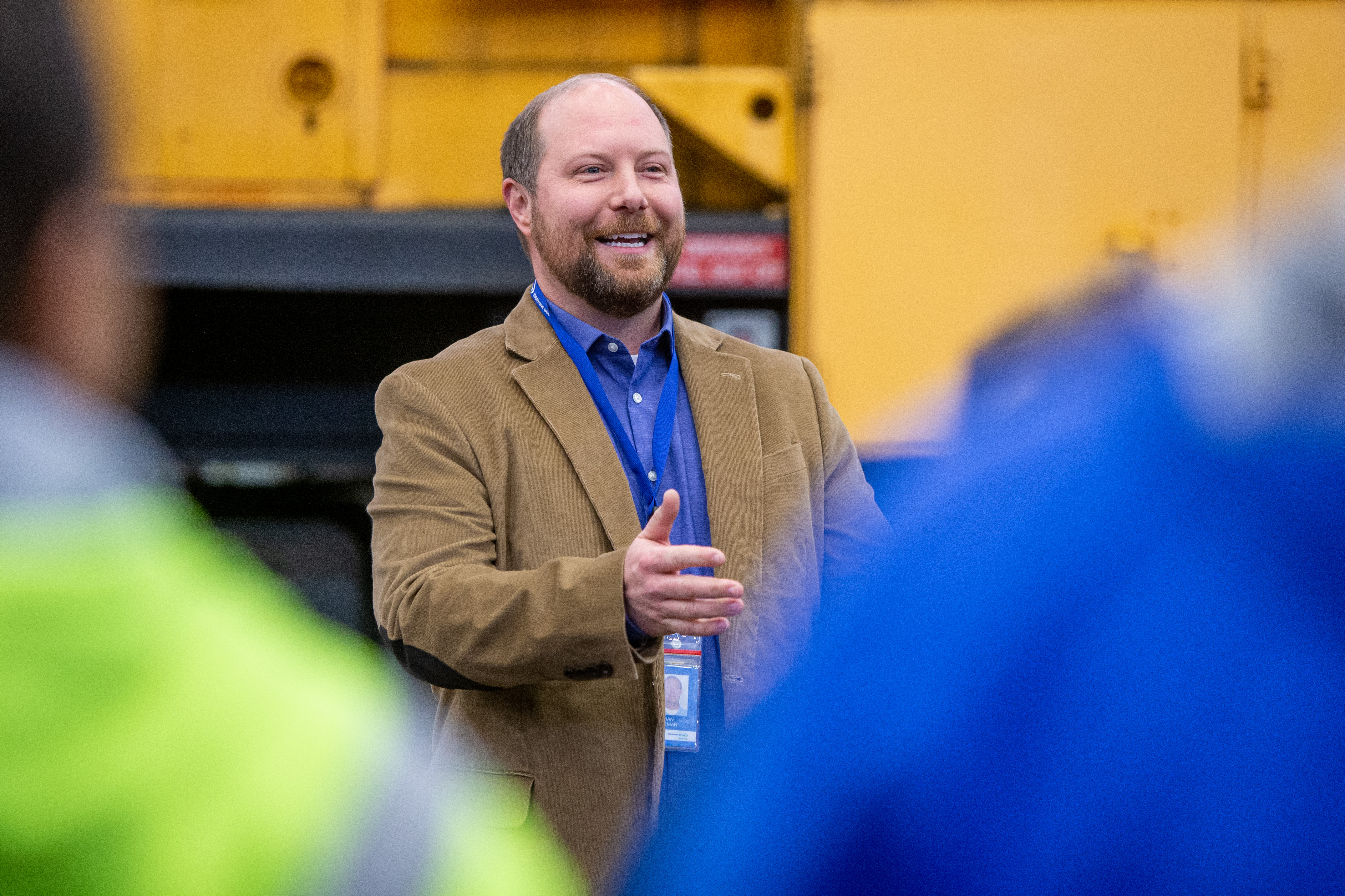 Nathan Hoffman, director of operations at the Consumers Energy J.H. Campbell plant, speaks in front of a 1979 GE diesel train locomotive at the plant in Port Sheldon Township on Monday, Feb. 13, 2023. Consumers Energy is donating the locomotive to the Coopersville and Marne Railway. (Cory Morse | MLive.com)