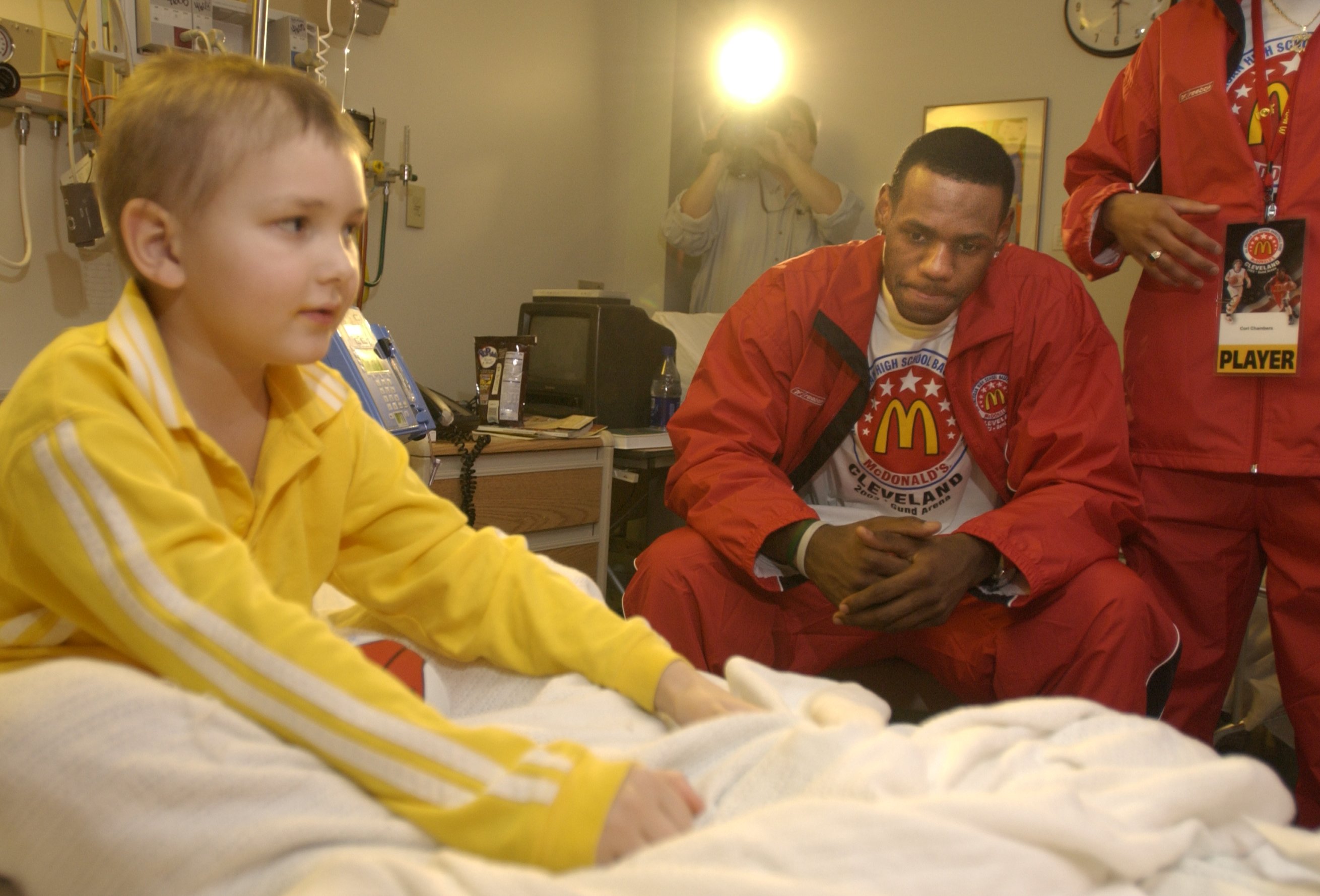 Tyler Heckman, 7, of Copley Twp. in Summit County, got a visit from a group of players that included local standout LeBron James as groups of players toured Akron Children's Hospital Sunday afternoon.     SUNDAY MARCH 23,2003 (BILL KENNEDY/PLAIN DEALER)