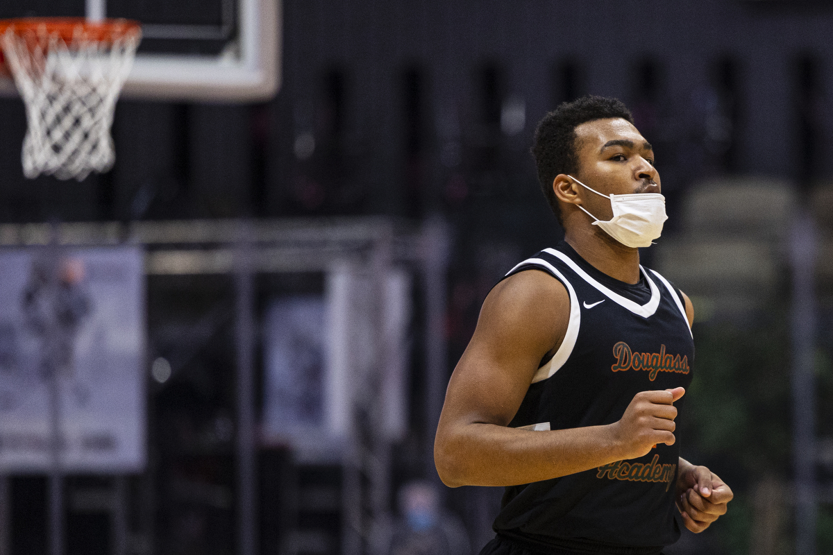 Photos of Detroit Douglass basketball player Pierre Brooks II