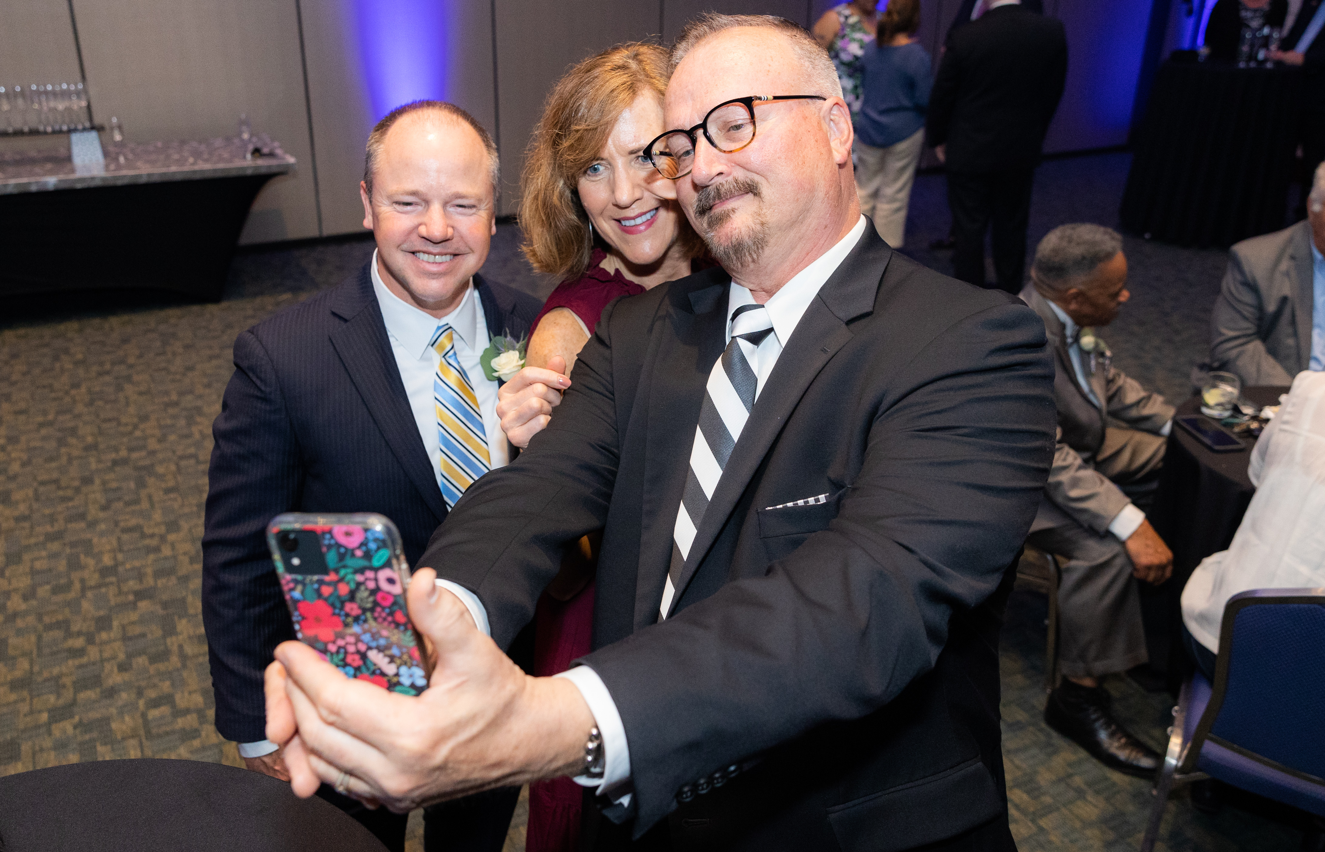 The Republican's advertising director Mark French, Greater Springfield Convention and Visitors Bureau's president Mary Kay Wydra, and Ed Pessolano, owner of Design & Advertising Associates, take a selfie together during the 25th annual Howdy Awards for Hospitality Excellence held at the MassMutual Center Monday evening, May 16, 2022. (Hoang ‘Leon’ Nguyen / The Republican)