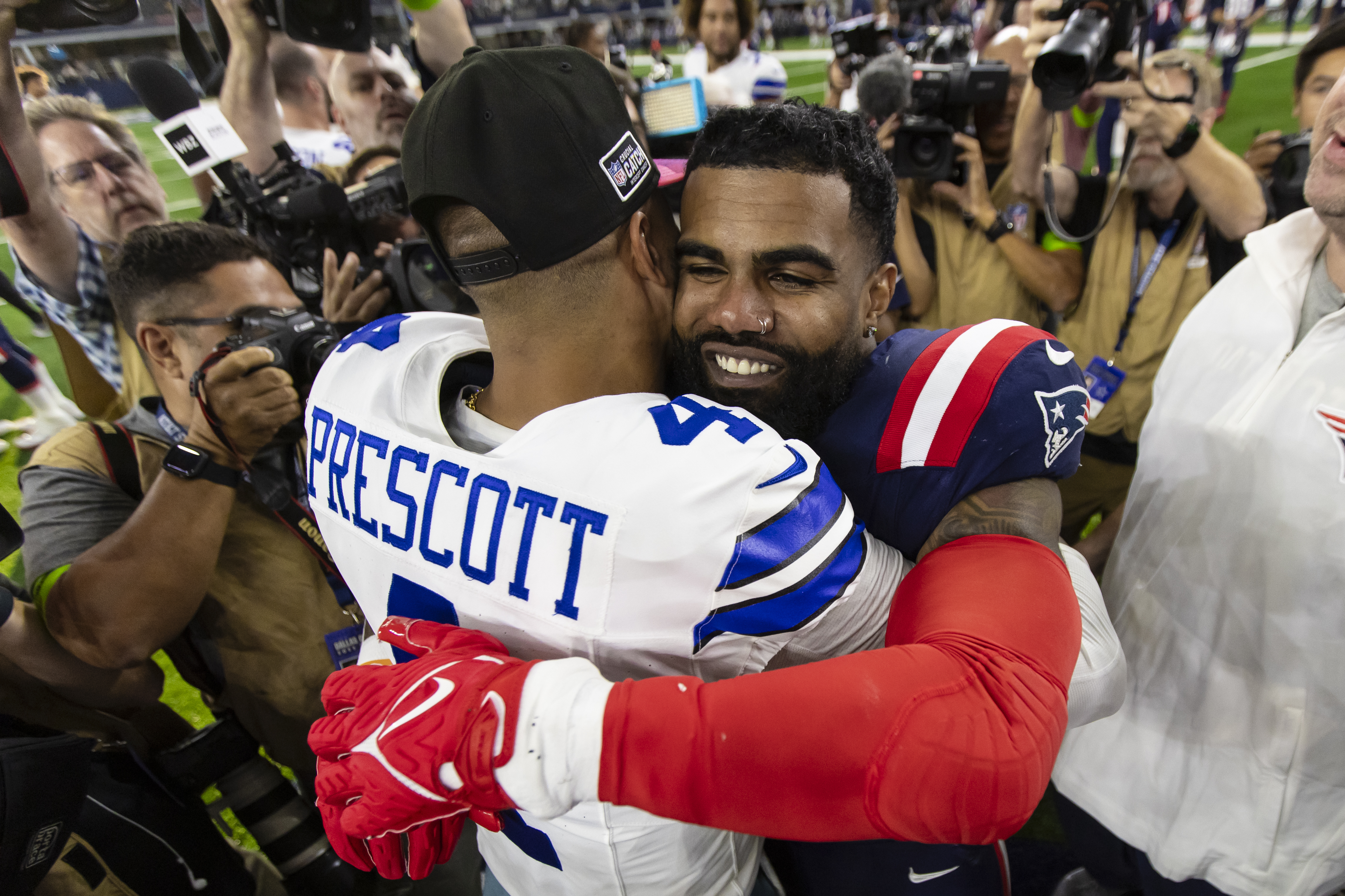 Prescott, Elliott getting used to being former teammates with