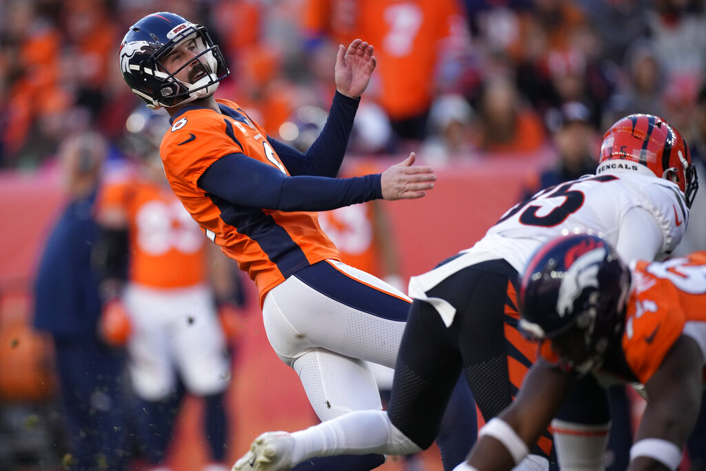 Cincinnati Bengals quarterback Joe Burrow (9) looks out to his receivers  during an NFL football game between the Indianapolis Colts and Cincinnati  Bengals, Sunday, Oct. 18, 2020, in Indianapolis. (AP Photo/Zach Bolinger