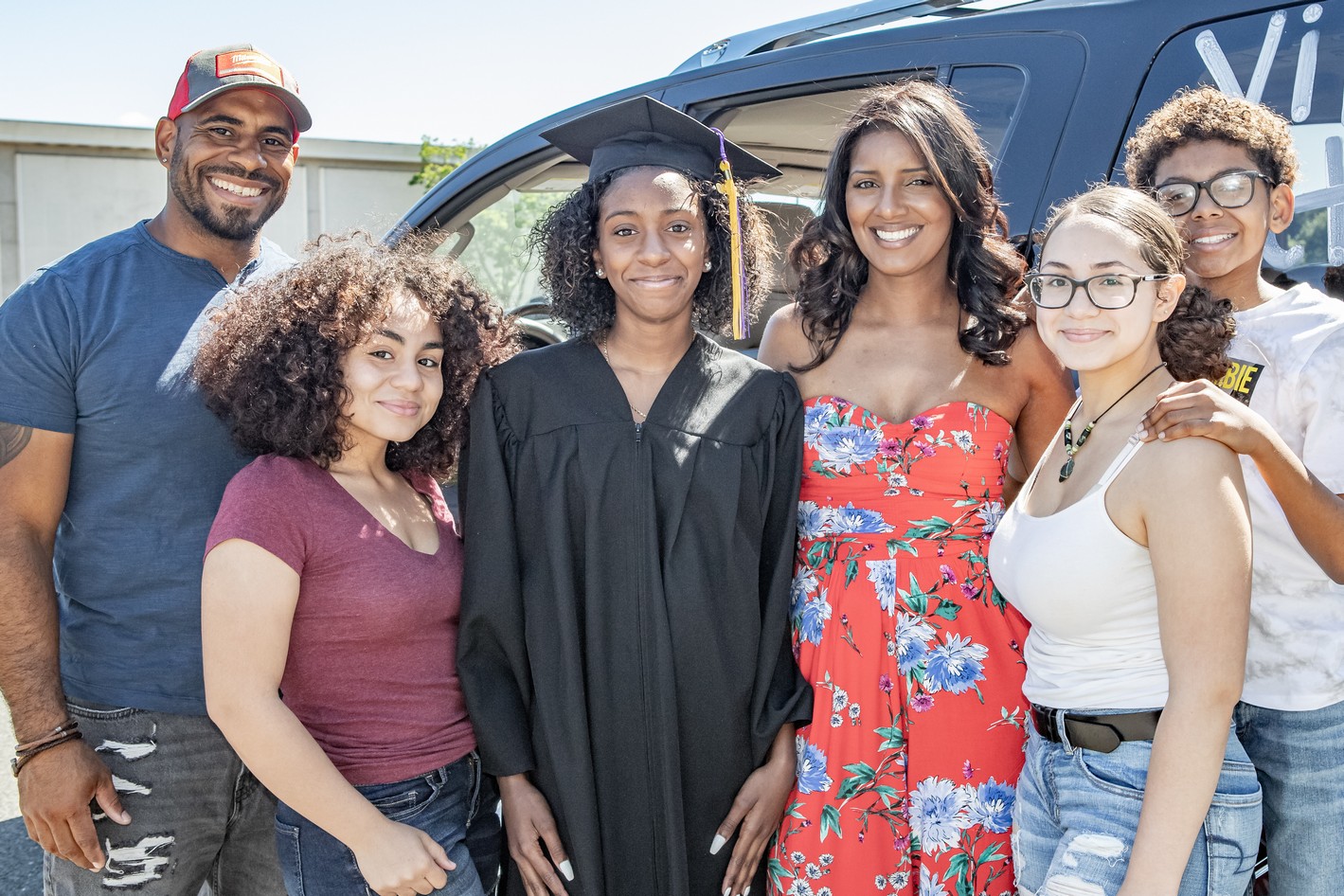 Nazha Osborn and family pose for a photo at the Veritas Prep Charter School 8th grade 2020 DRIVE-In Graduation held in the parking lot of the Eastfield Mall. (Danny Nason Photo)