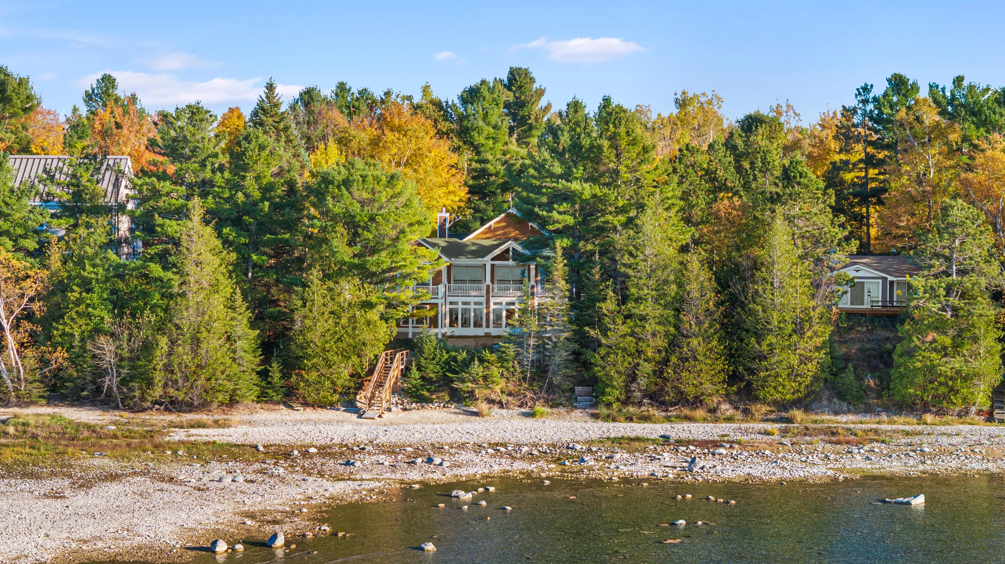 Aerial photographs of 4093 Lake Shore Drive in Charlevoix, this gem is listed at $2,099,900 through Berkshire Hathaway HomeServices Michigan Real Estate – Traverse City and The Crane Group with associate broker Johnny Crane and his brother, co-listing agent Matt Crane.