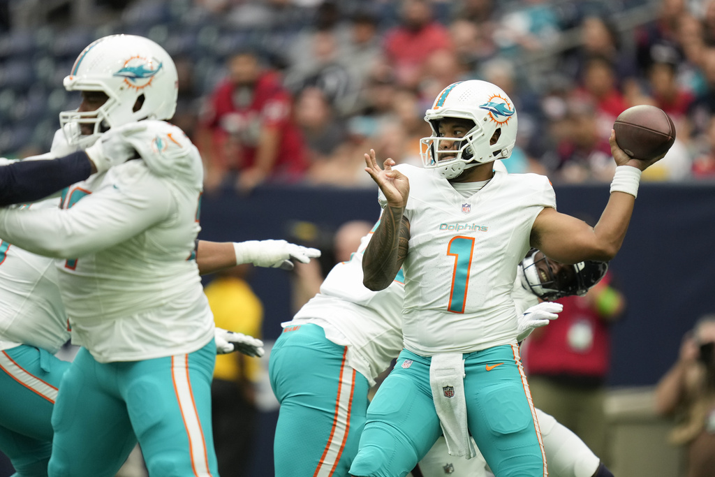 Jacksonville, United States. 26th Aug, 2023. Miami Quarterback Tua  Tagovailoa throws a short pass for a completion in the first quarter as the  Dolphins compete against the Jaguars in an NFL preseason