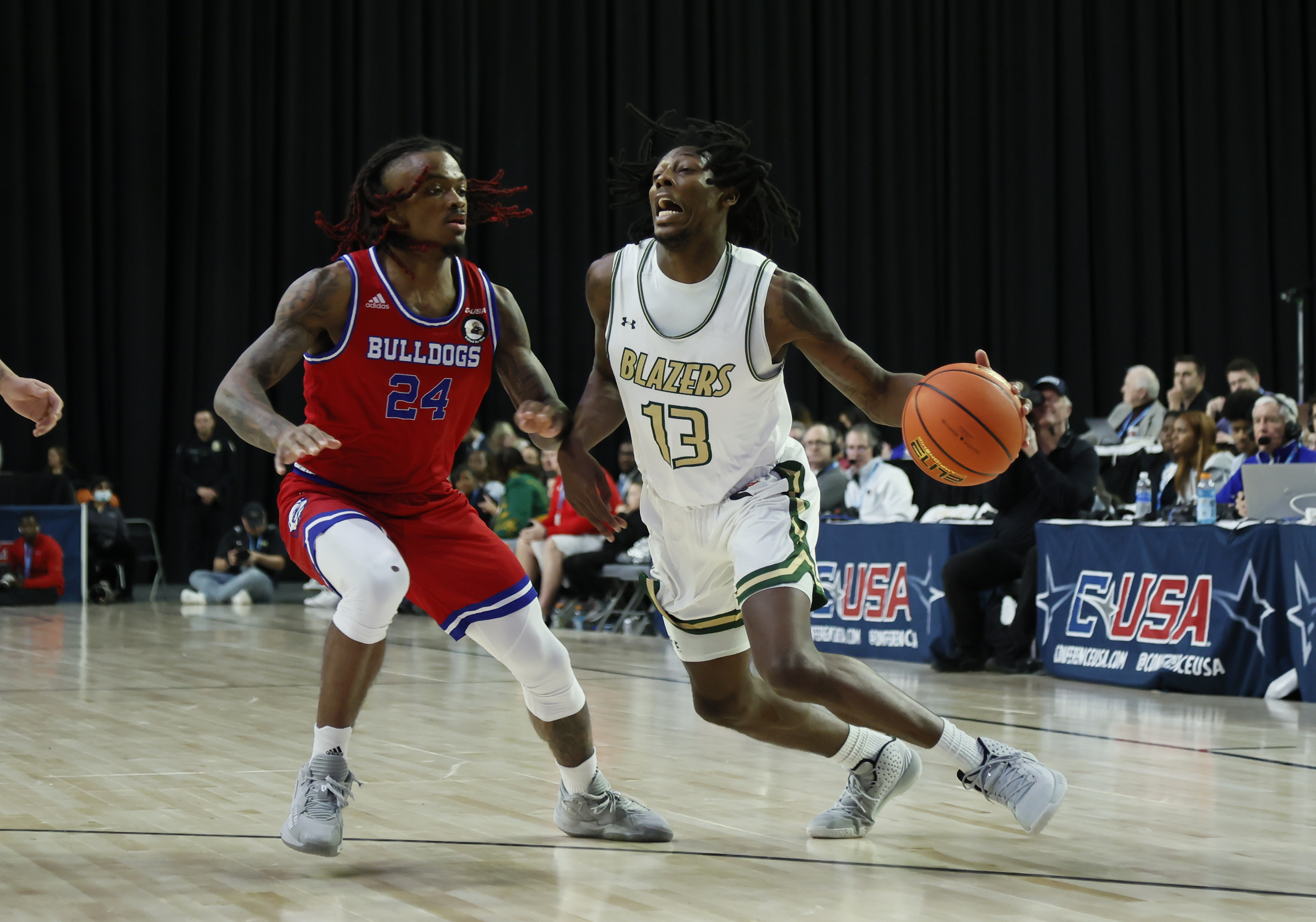 Louisiana Tech forward Kenneth Lofton Jr. advances the ball