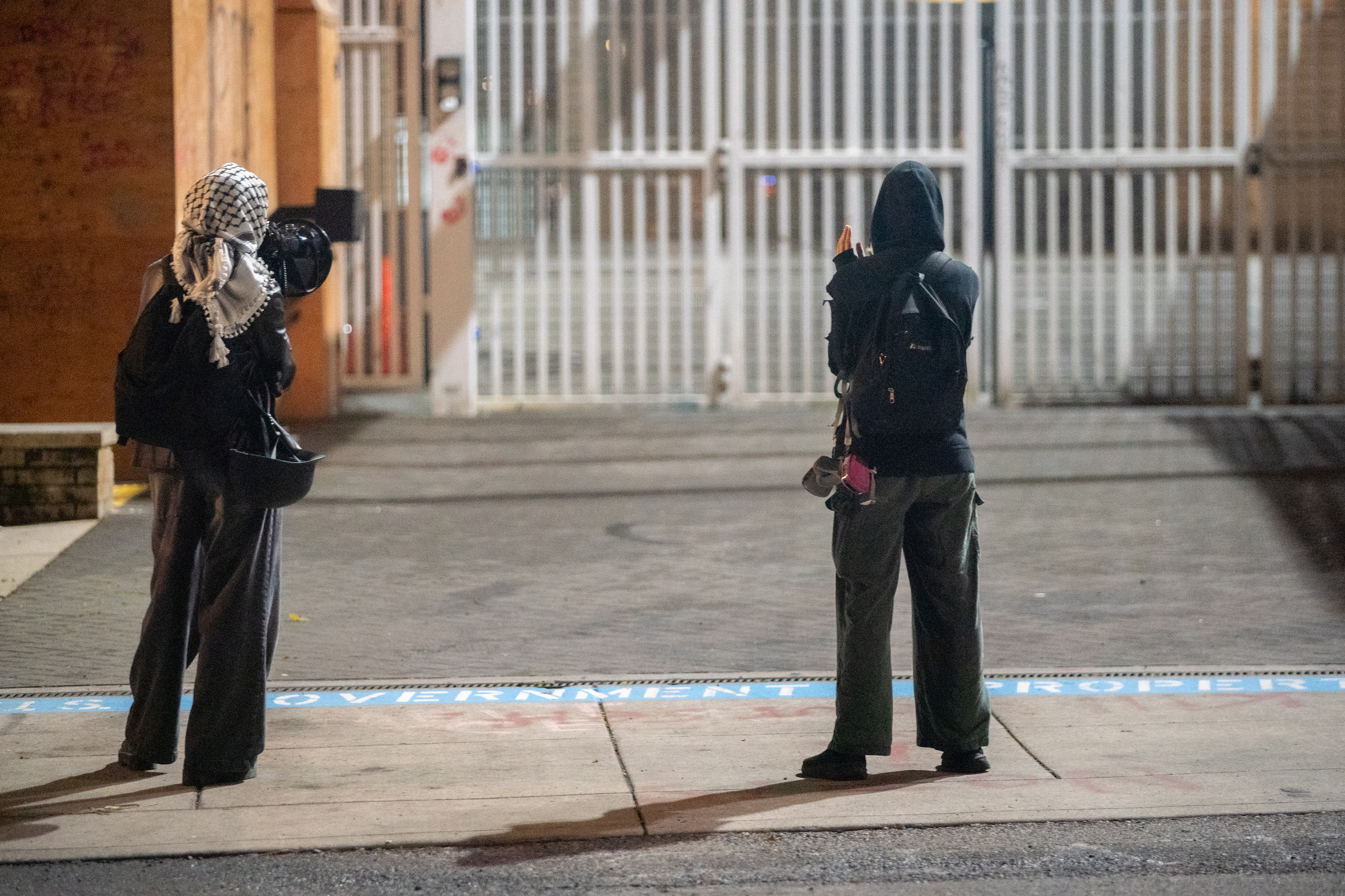 Protesters gather outside the boarded-up U.S. Immigration and Customs Enforcement building in South Portland on Monday, Sept. 8, 2025, days after President Donald Trump suggested federal intervention.