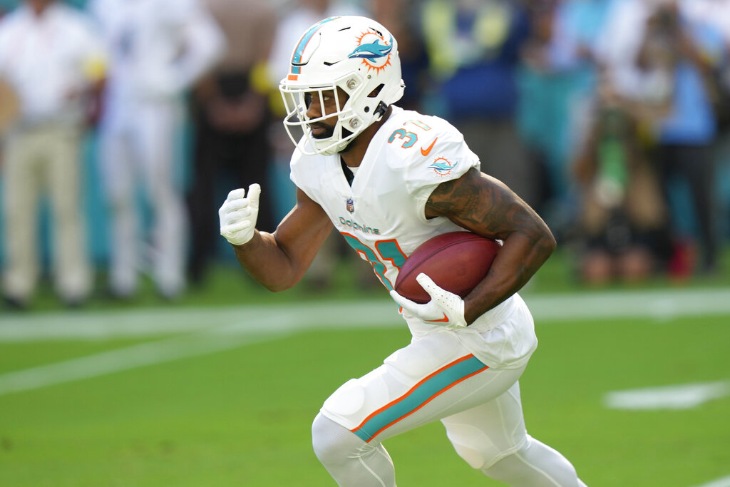 Miami Dolphins running back Raheem Mostert (31) runs for a touchdown during  the second half of an NFL football game against the Cleveland Browns,  Sunday, Nov. 13, 2022, in Miami Gardens, Fla. (