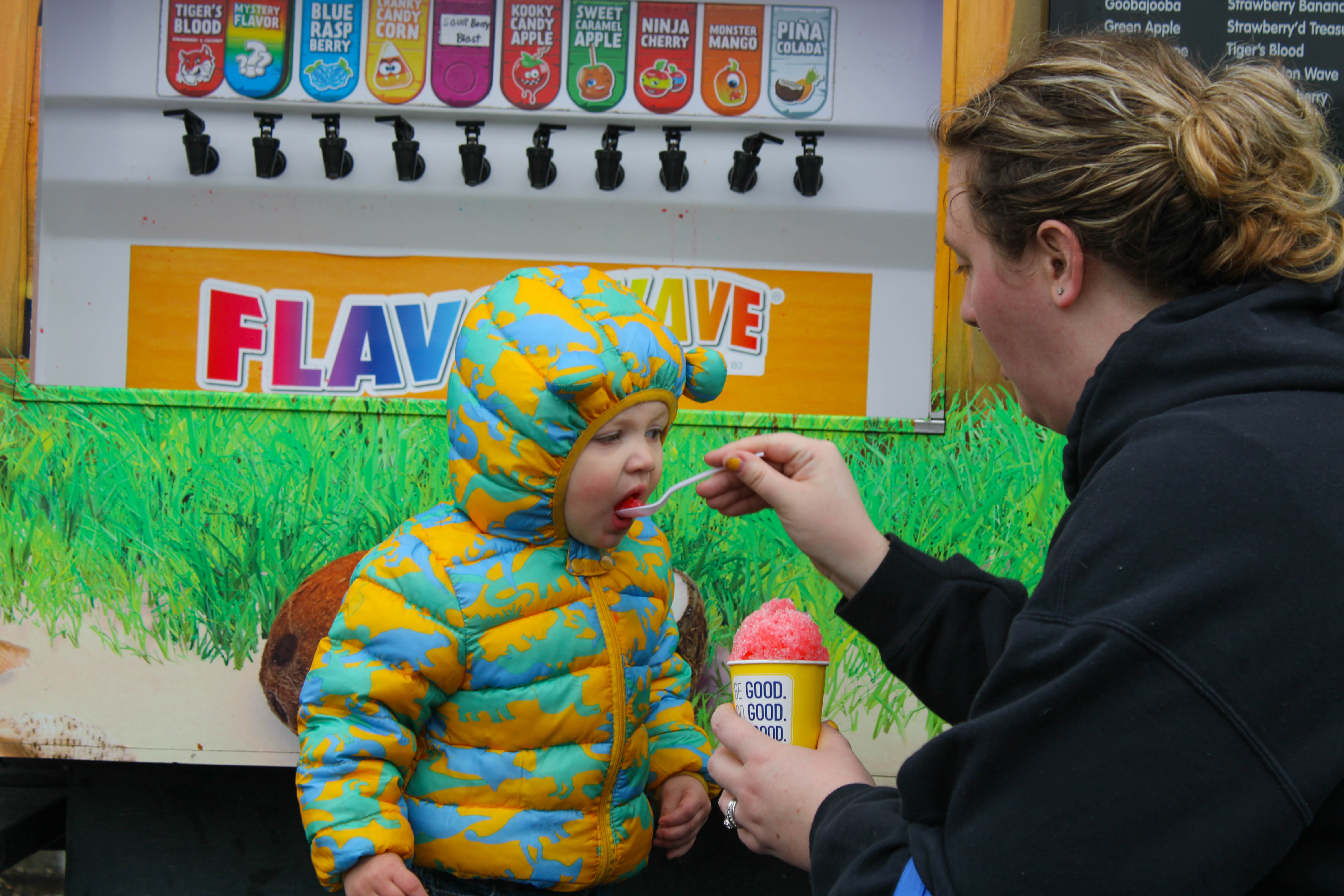 Oliver Payne, 2, eats a snowcone at the Harvest Day Festival in Elmer, Saturday, Oct. 1,  2022.