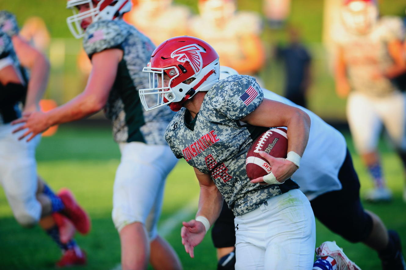 Floating helmets, dramatic skies and acrobatic grabs: Our favorite photos  from the 2016 high school football season