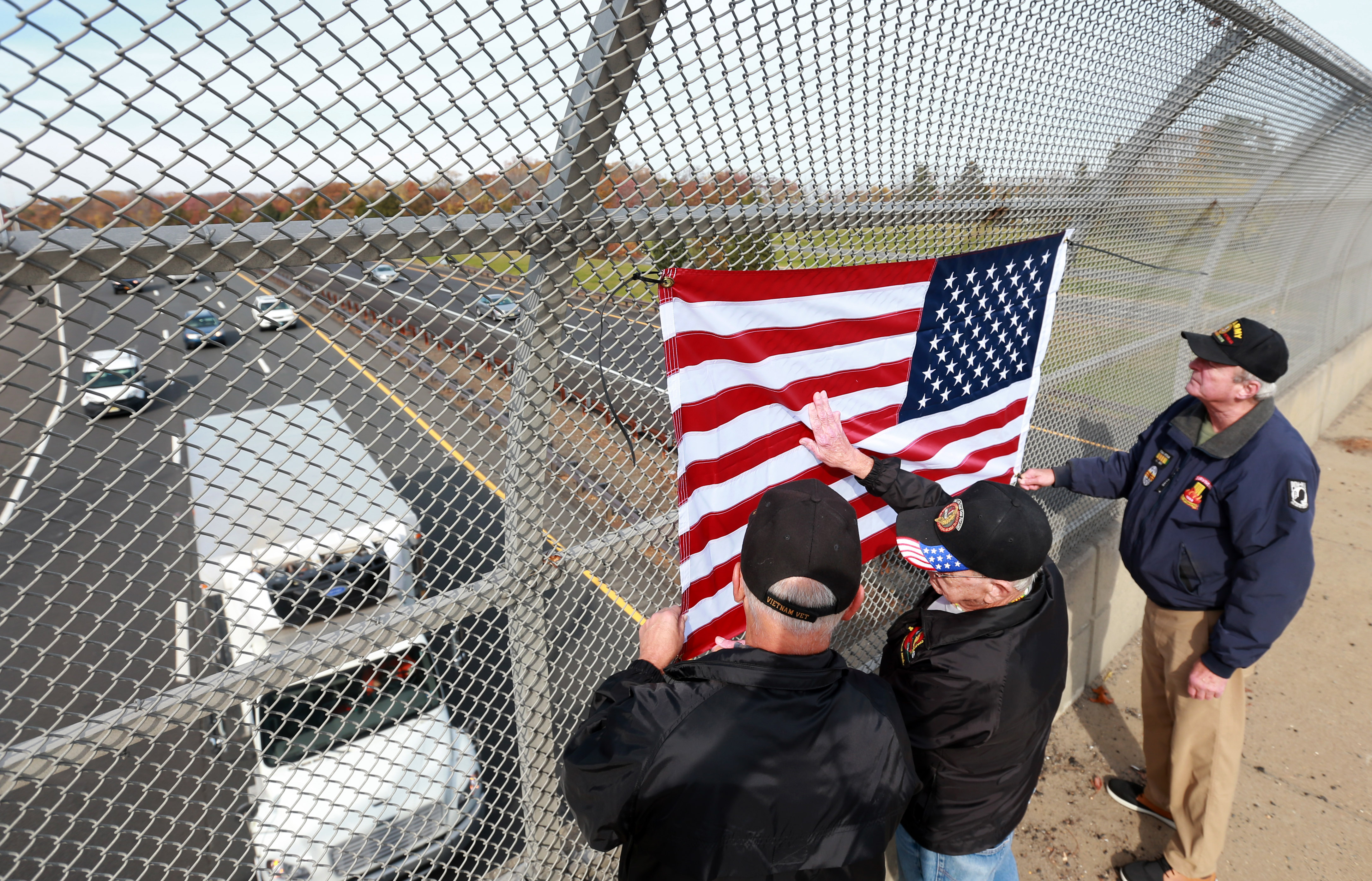 New Jersey National Guard Soldiers hold the American Flag along side other  service members and veterans at MetLife Stadium in East Rutherford, New  Jersey, Nov. 6, 2022. Soldiers of the New Jersey