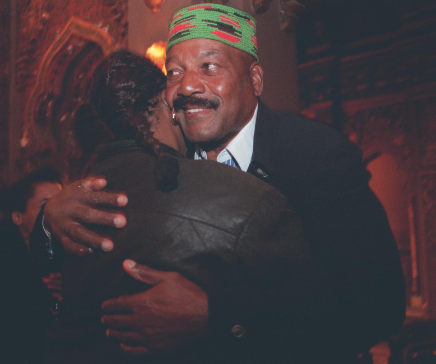 After waiting Diane Scimone of Syracuse gets the hug of her life by idol Jim Brown during a reception for the 1996 Syracuse Walk of Stars at the Landmark Theatre tonight. Said Diane, "I love him. I love his football, I love his movies, I am his number one fan!"