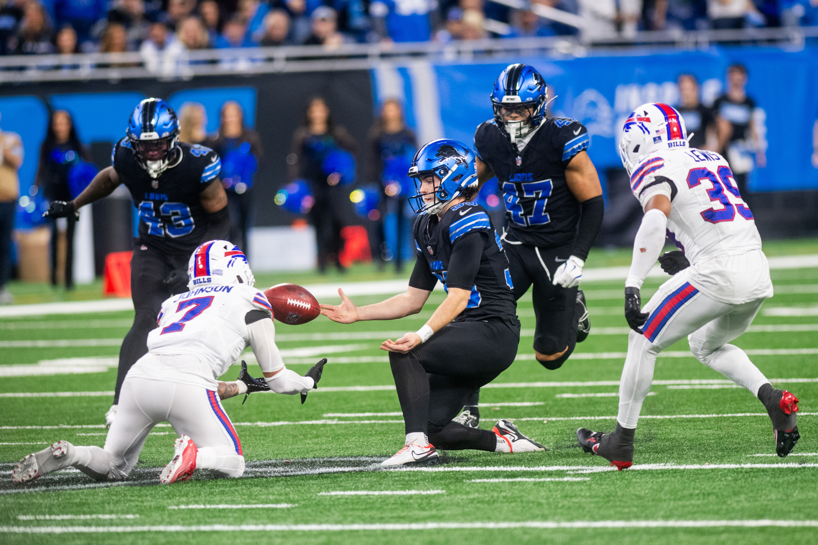 Detroit Lions place kicker Jake Bates (39) tries to recover his second onside kick of the day with 12 seconds left in the game during the Detroit Lions game against the Buffalo Bills at Ford Field on Sunday, Dec. 15, 2024. Lions lost to the Bills, 48-42.