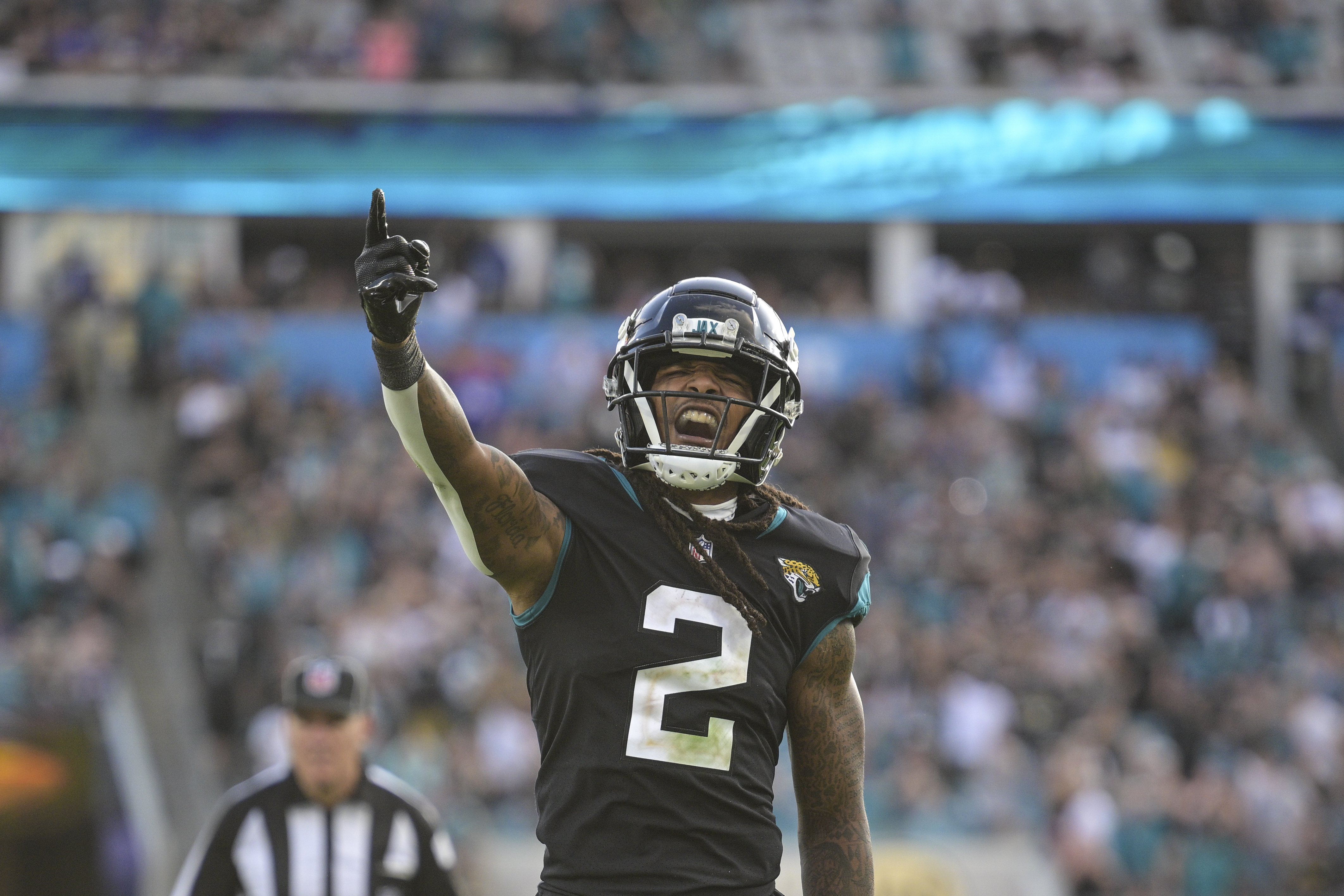 Jacksonville Jaguars safety Andre Cisco (5) breaks up a pass intended for  Baltimore Ravens tight end Mark Andrews (89) during the second half of an  NFL football game, Sunday, Nov. 27, 2022