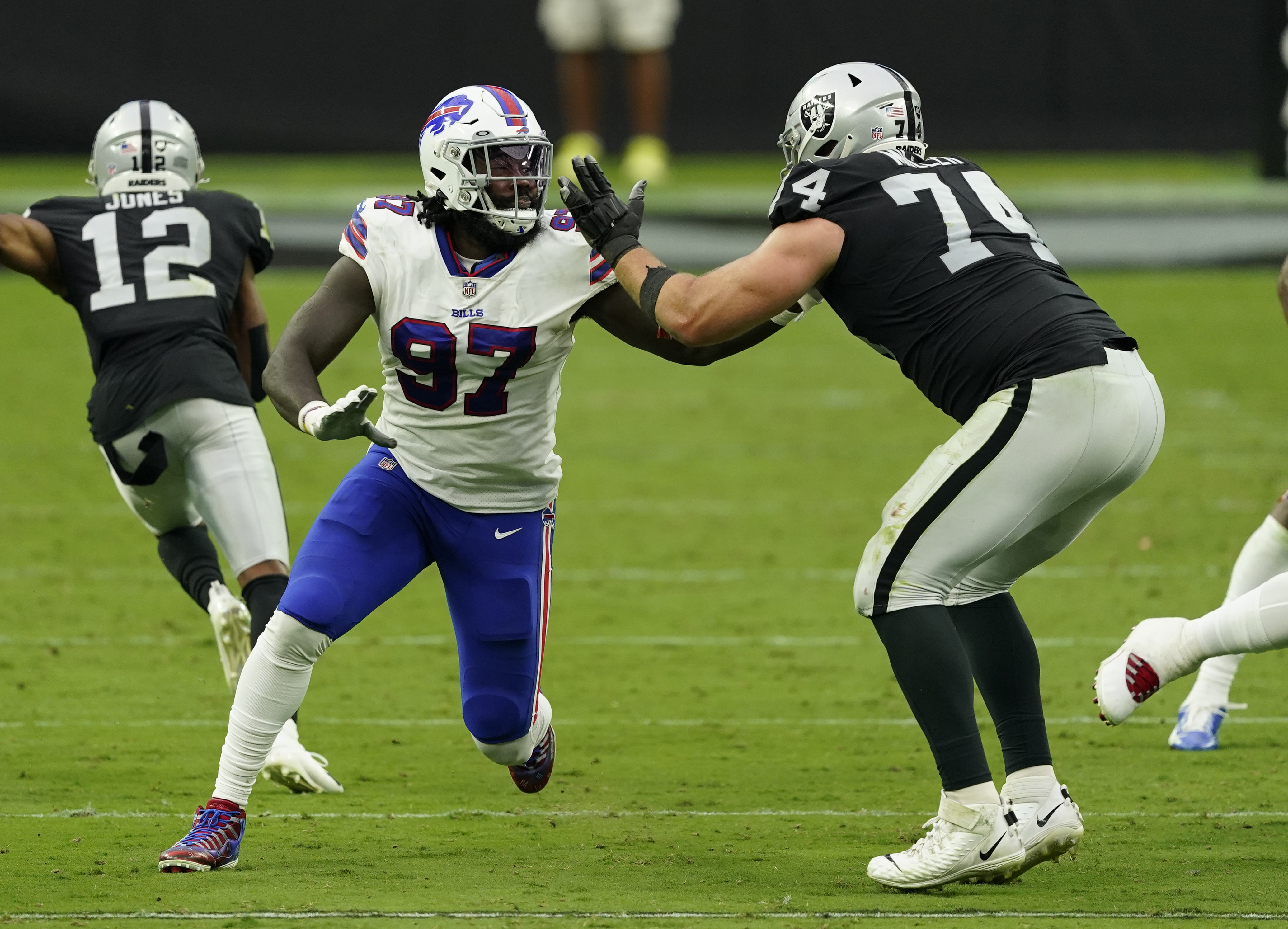 Buffalo Bills defensive end Mario Addison (97) tackles Las Vegas Raiders  Las Vegas Raiders wide …