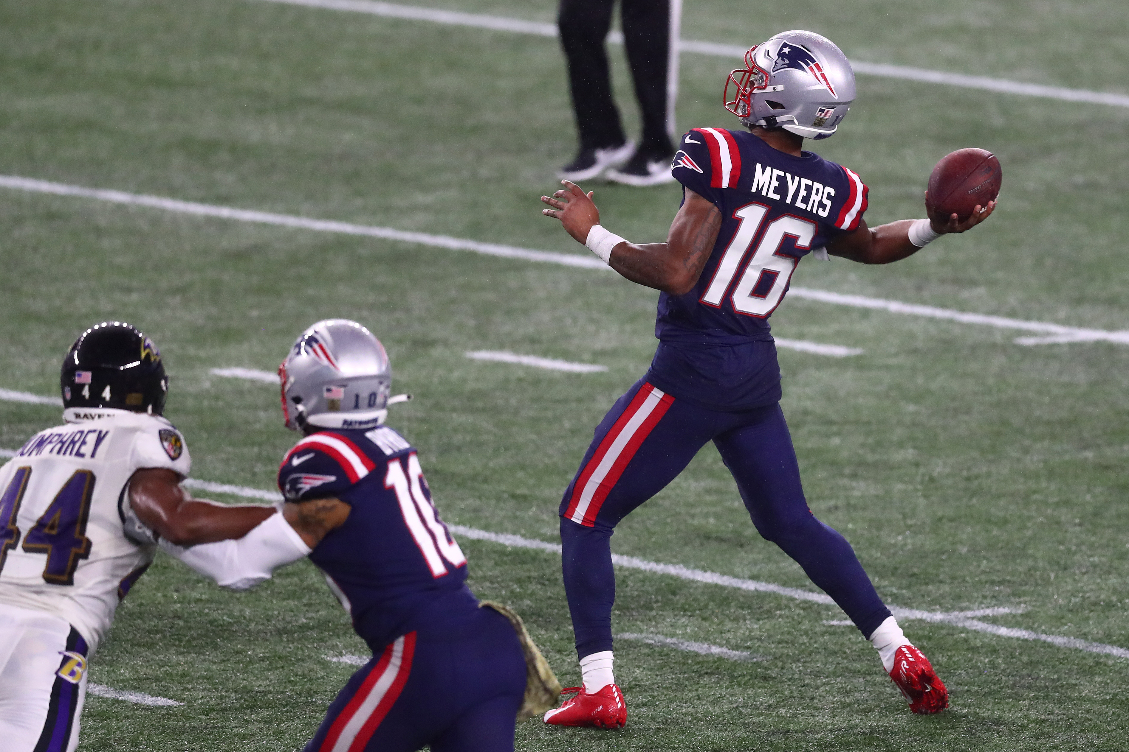 Patriots defeat Ravens at a wet Gillette Stadium