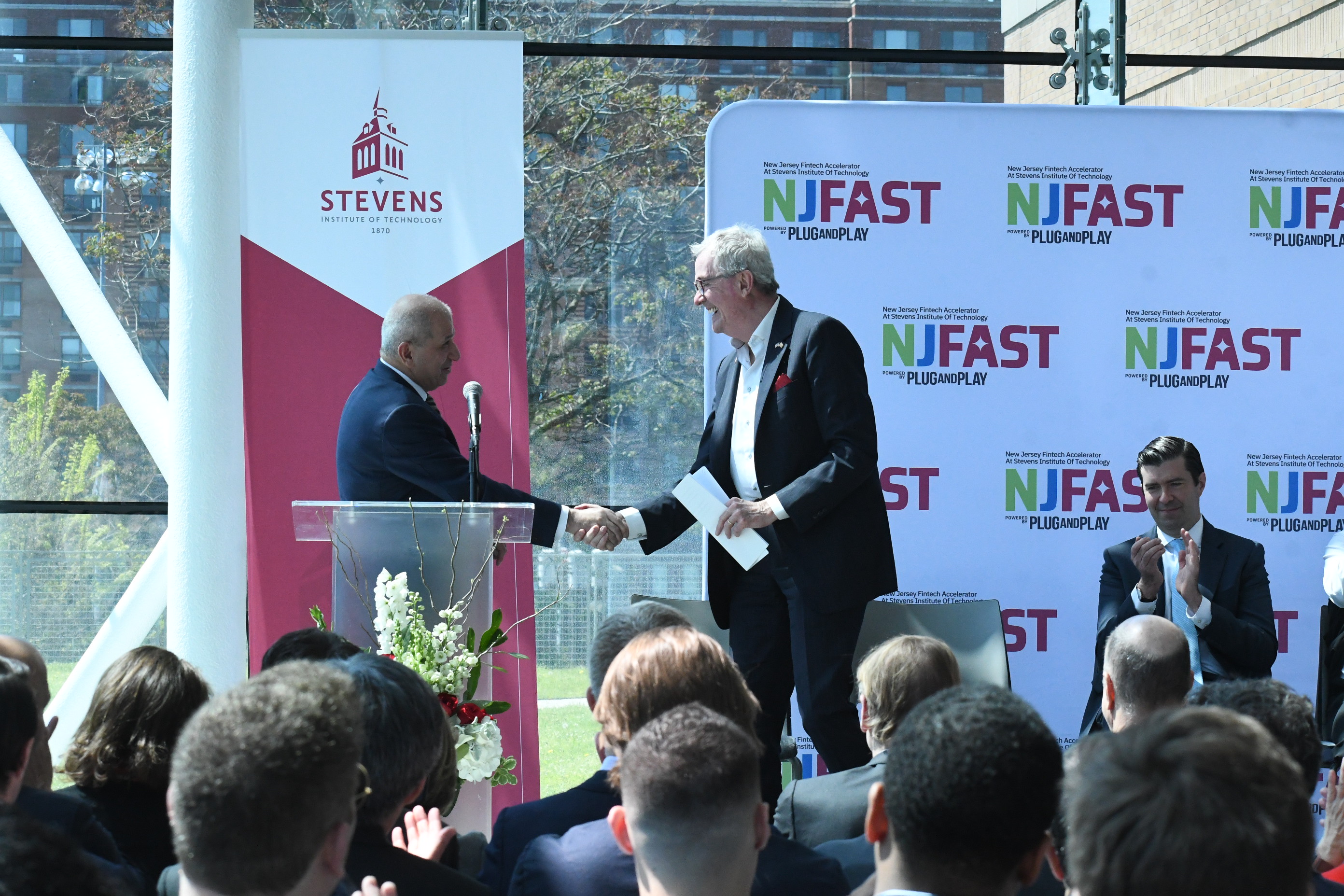 Gov. Phil Murphy, New Jersey Economic Development Authority Executive Director Tim Sullivan and other officials announce the launch of the New Jersey Fintech Accelerator at Stevens Institute of Technology (NJ FAST), which will serve as a hub for financial technology and insurance technology startups. Stevens President Nariman Farvardin is seen shaking hands with Murphy.
