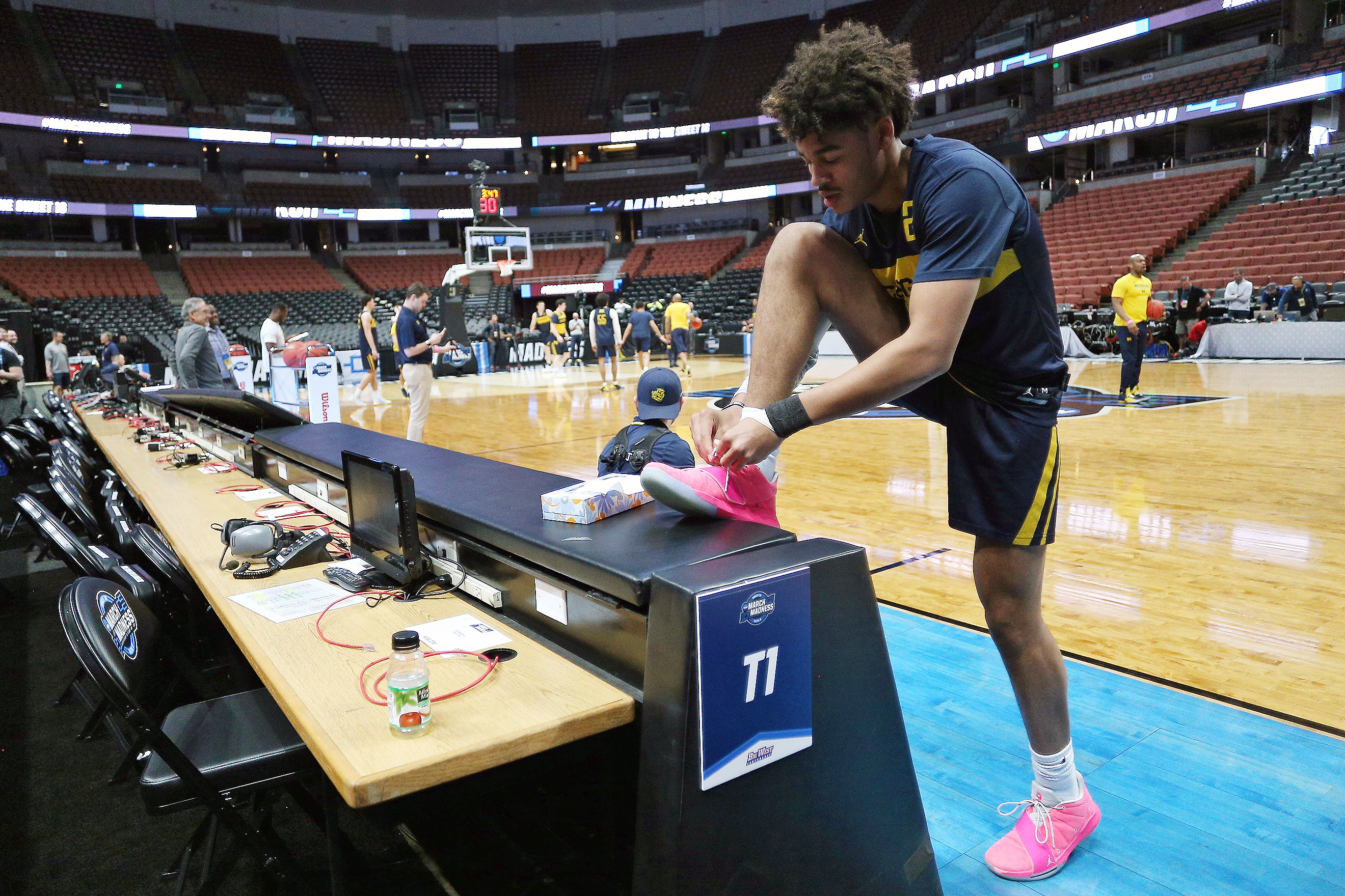 Why do some Michigan basketball players wear pink shoes mlive