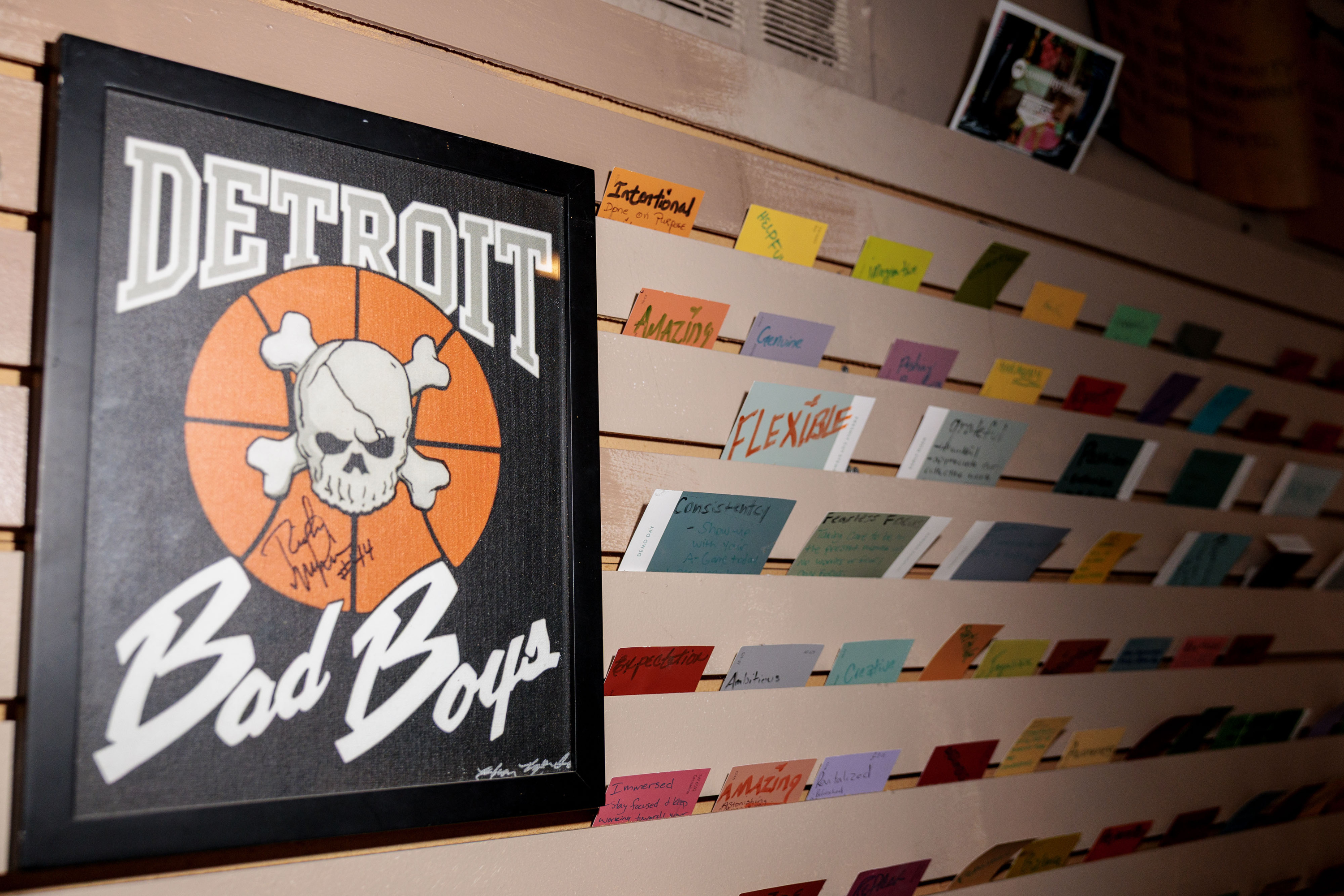 A Detroit Pistons poster signed by Rick Mahorn hangs in the entryway at Pingree Detroit, 15707 Livernois in Detroit on Monday, Oct. 6 2025.