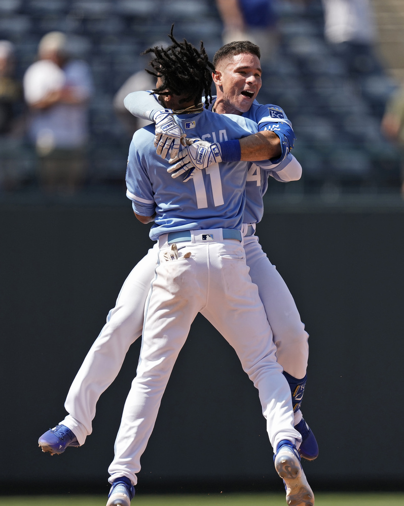 Maikel Garcia of the Kansas City Royals celebrates with Salvador