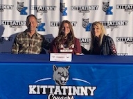 Kittatinny's Ashley Gordon, center, signs to continue her soccer and track career at Ramapo College.