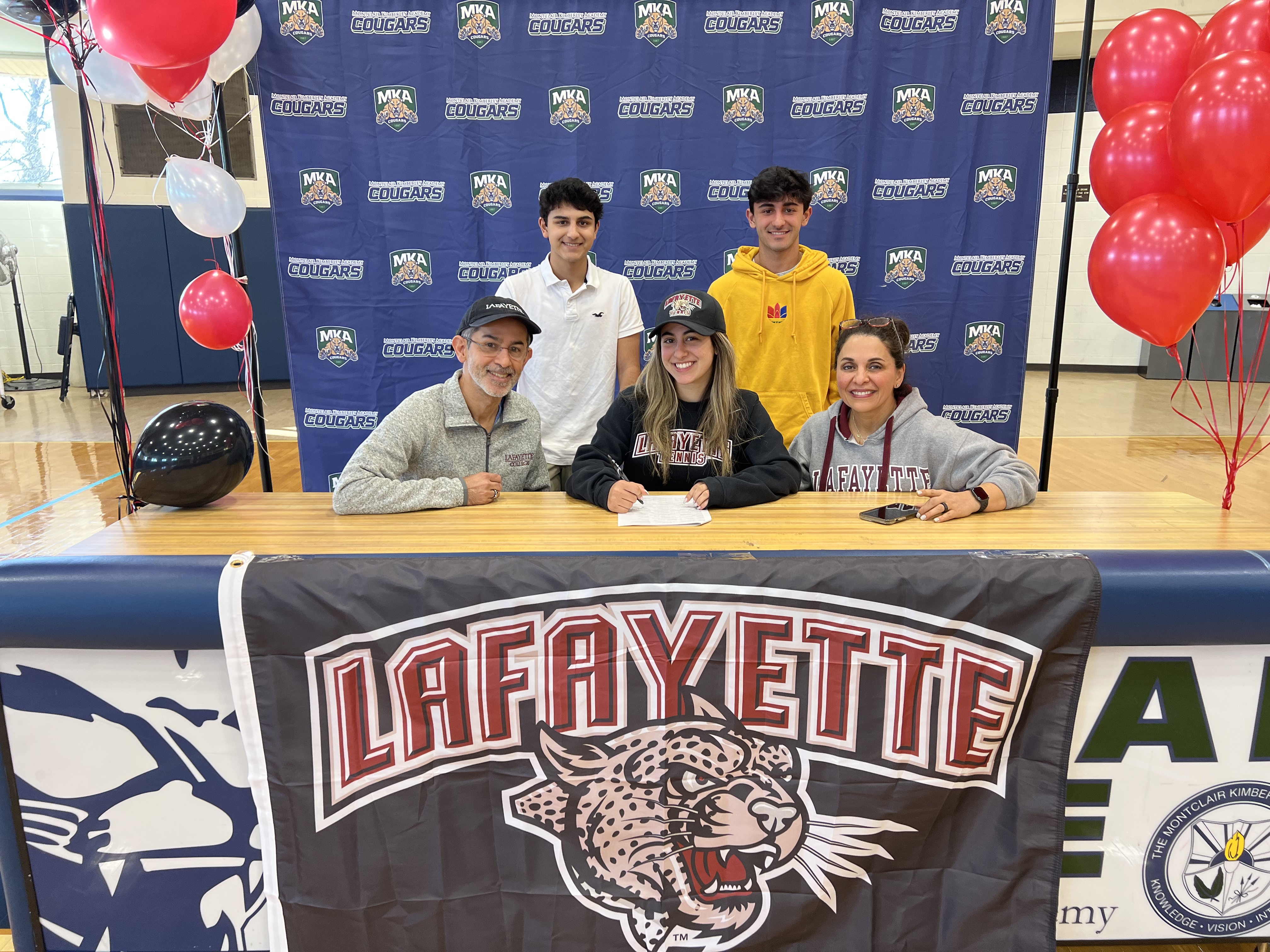 MKA's Hanna Ganchi signs her NLI to play tennis at Lafayette with her family beside her