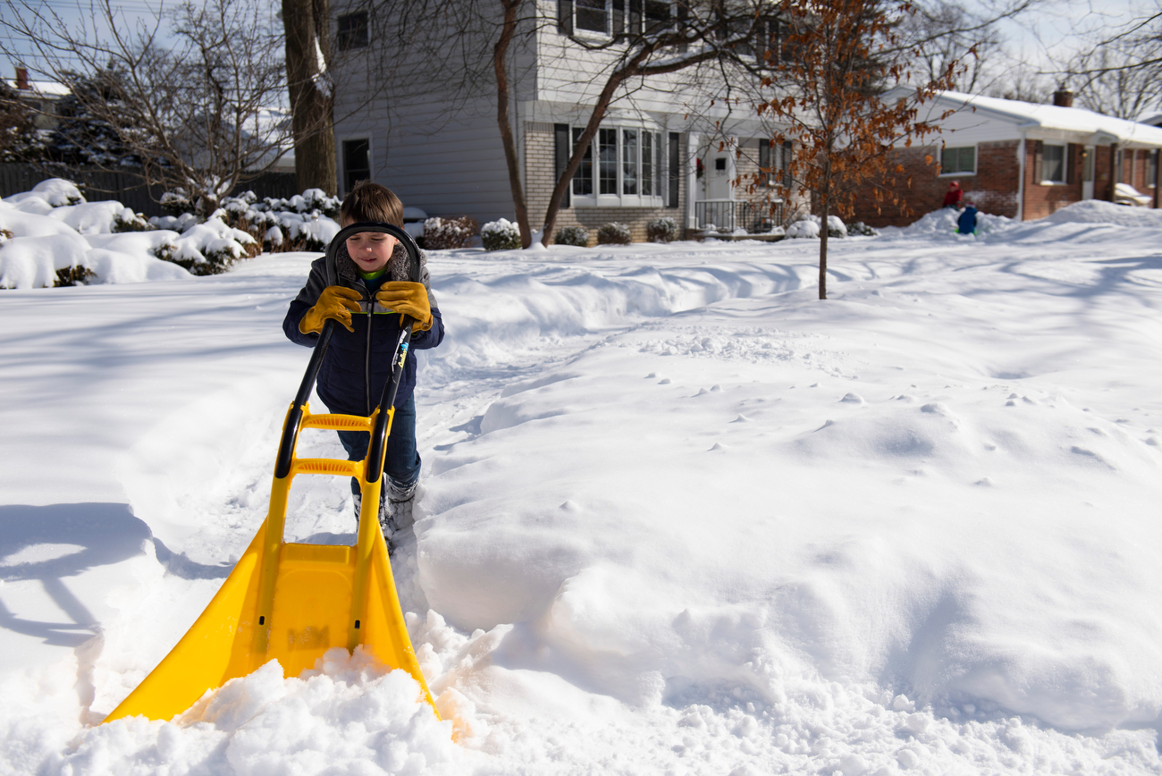 Kid starts a snow shoveling business to earn money and help people