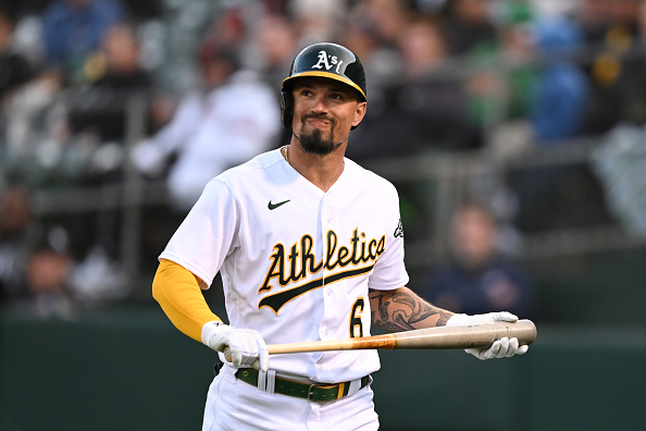 Oakland Athletics shortstop Aledmys Diaz (12) throws to first as Cleveland  Guardians' Steven Kwan (38) slides into second on a double play hit into by  Jose Ramirez during the third inning of