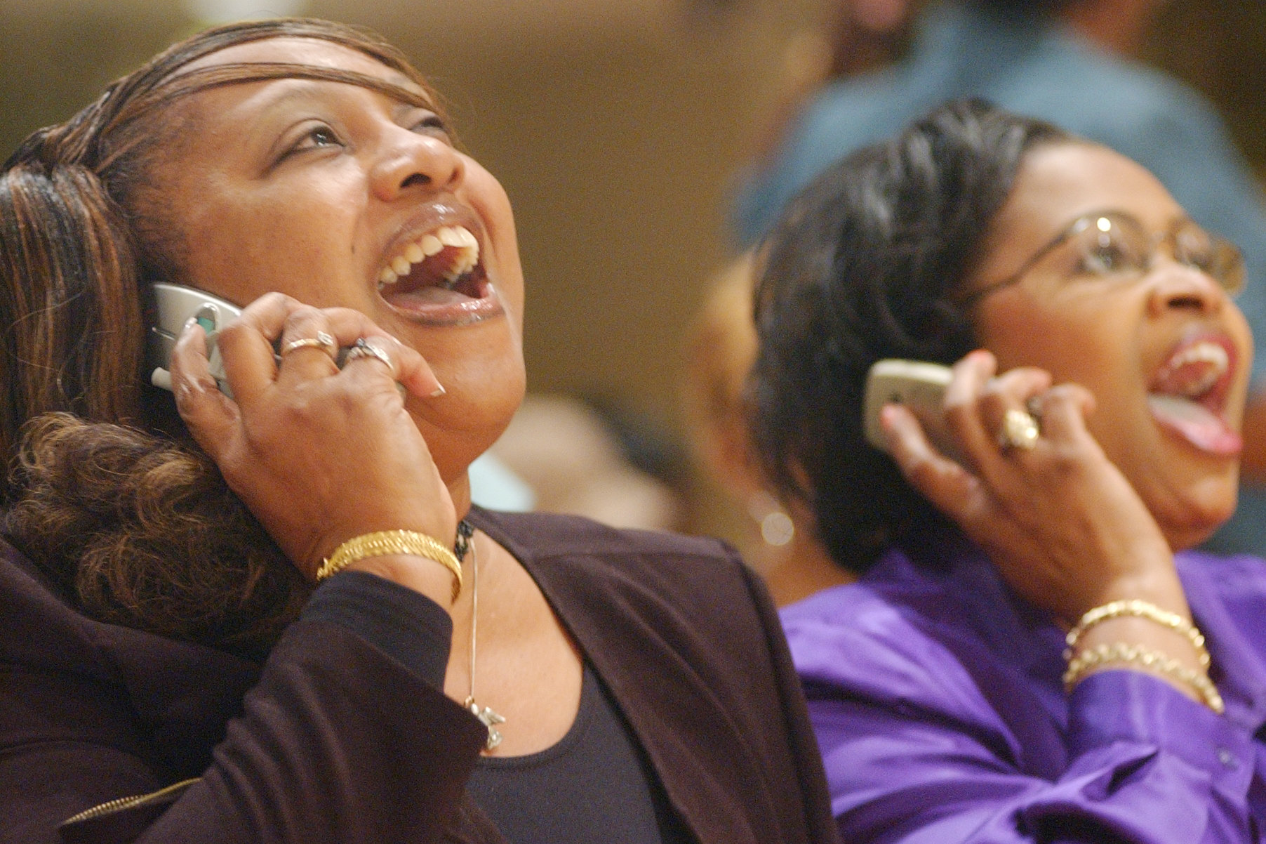 Constance Kelley and Belinda George Peoples, friends of Ruben Studdard's family, call in votes for him after watching Studdard compete in an "American Idol" episode. Watch parties were common in Birmingham during Studdard's "Idol" run. (AL.com file photo/Tamika Moore)