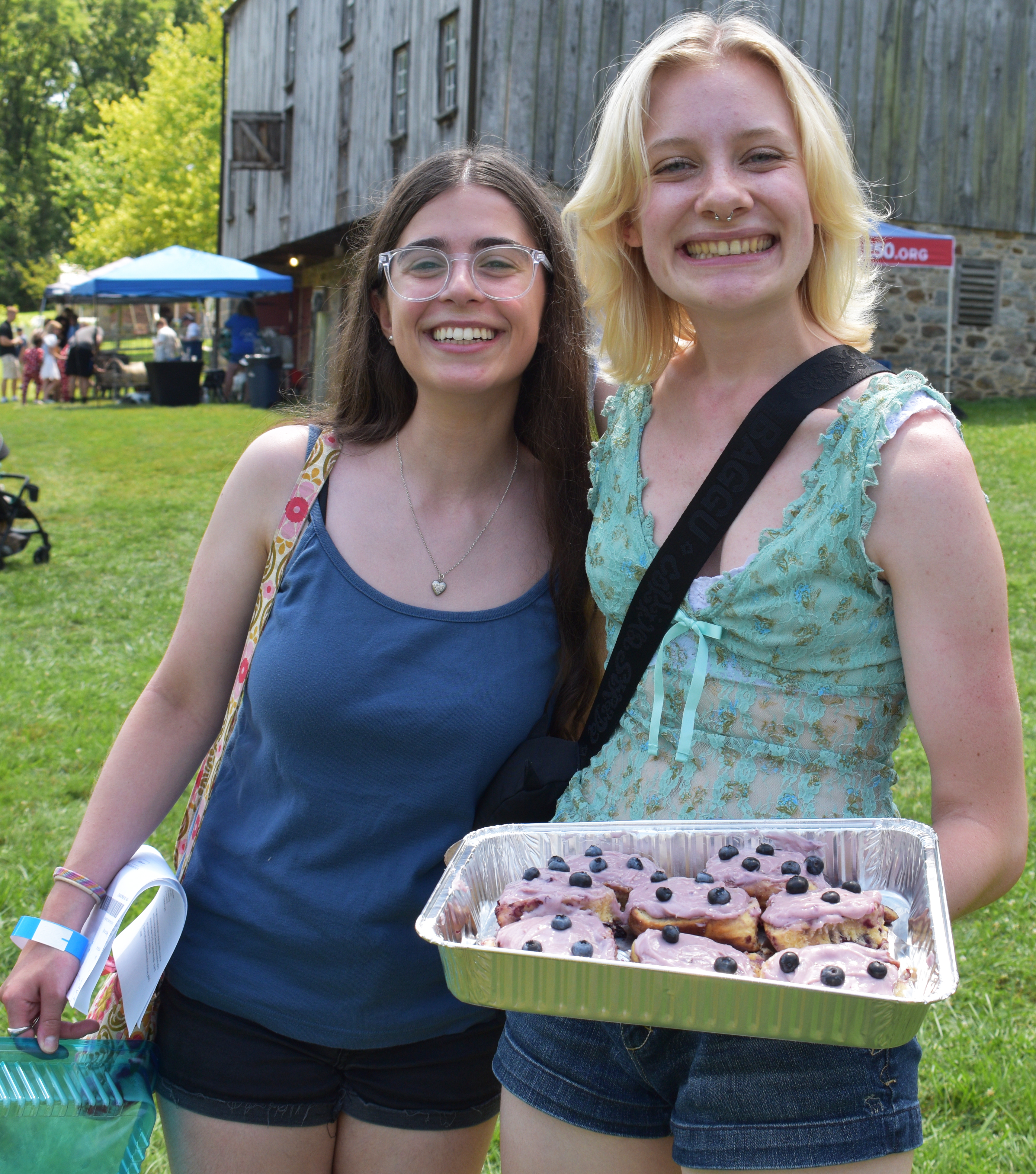 Isabel Holland, of Bethlehem, from right, prepares to deliver her blueberry cinnamon rolls for the Day 1 adult culinary contest with an assist from Anna Del Guercio, as Historic Bethlehem Museums & Sites opens its two-day Blueberry Festival & Market To Go on Saturday, July 13, 2024, at Burnside Plantation. It continues Sunday.