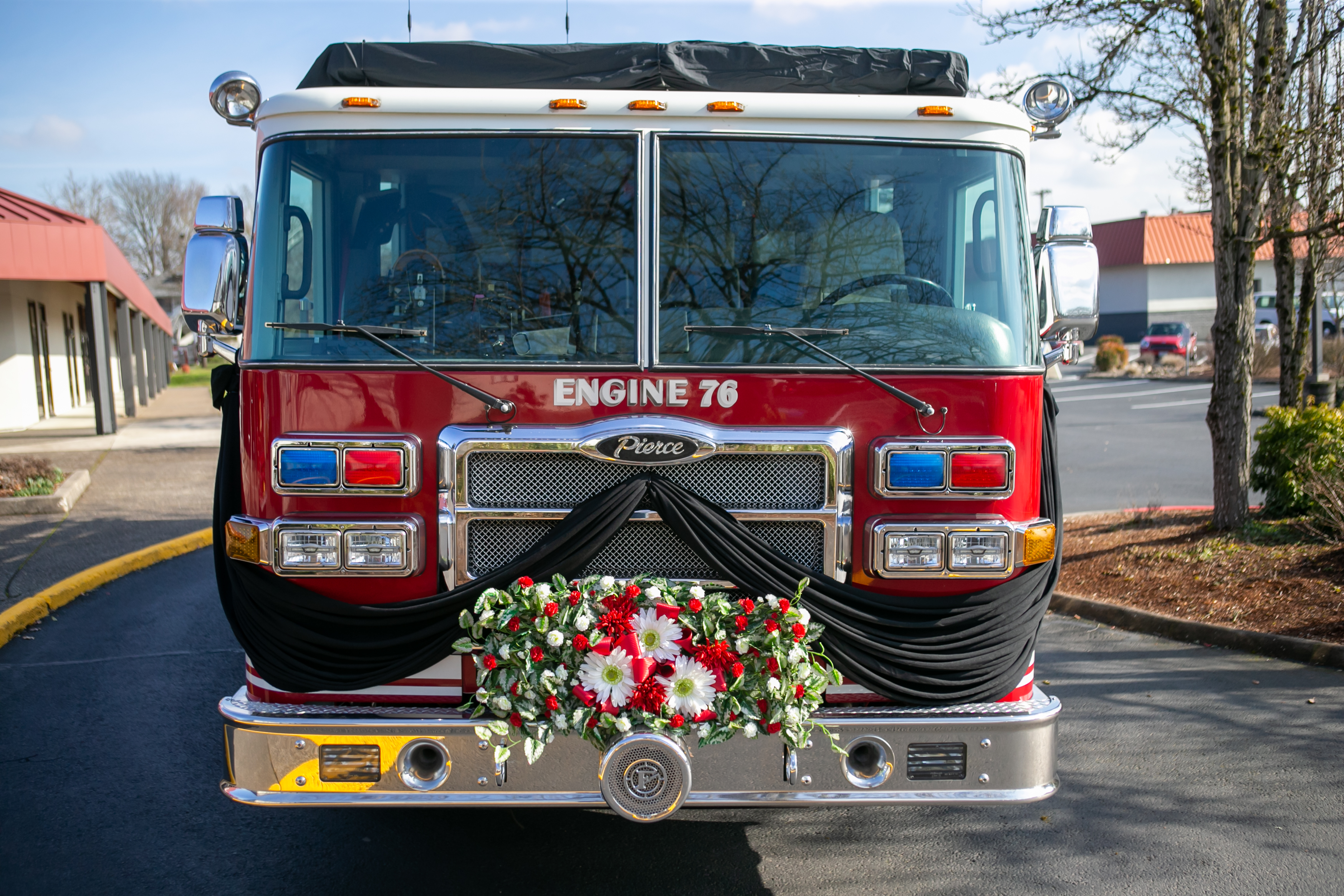 Fire engine No. 76 is adorned with flowers in honor of Gresham Firefighter Brandon Norbury in downtown Gresham, Oregon on Wednesday, Feb. 15 2023.