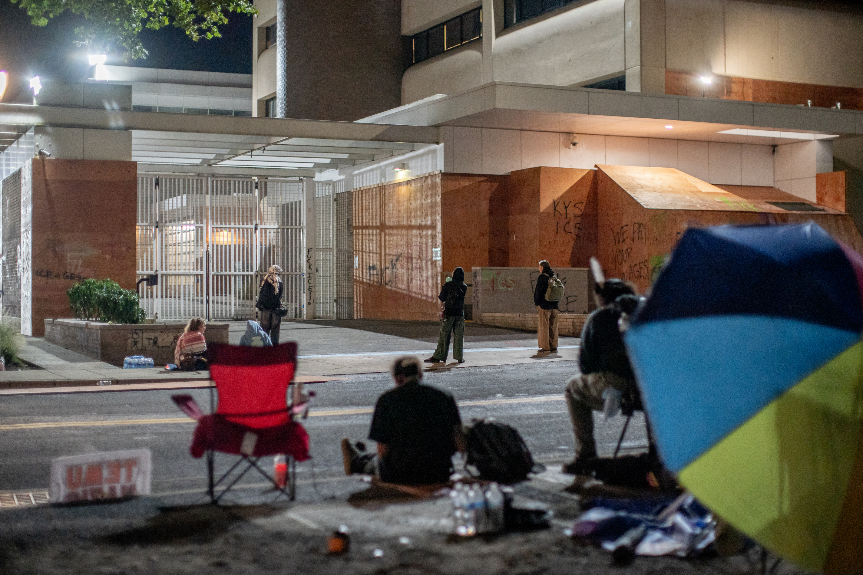 Protesters gather outside the boarded-up U.S. Immigration and Customs Enforcement building in South Portland on Monday, Sept. 8, 2025, days after President Donald Trump suggested federal intervention.