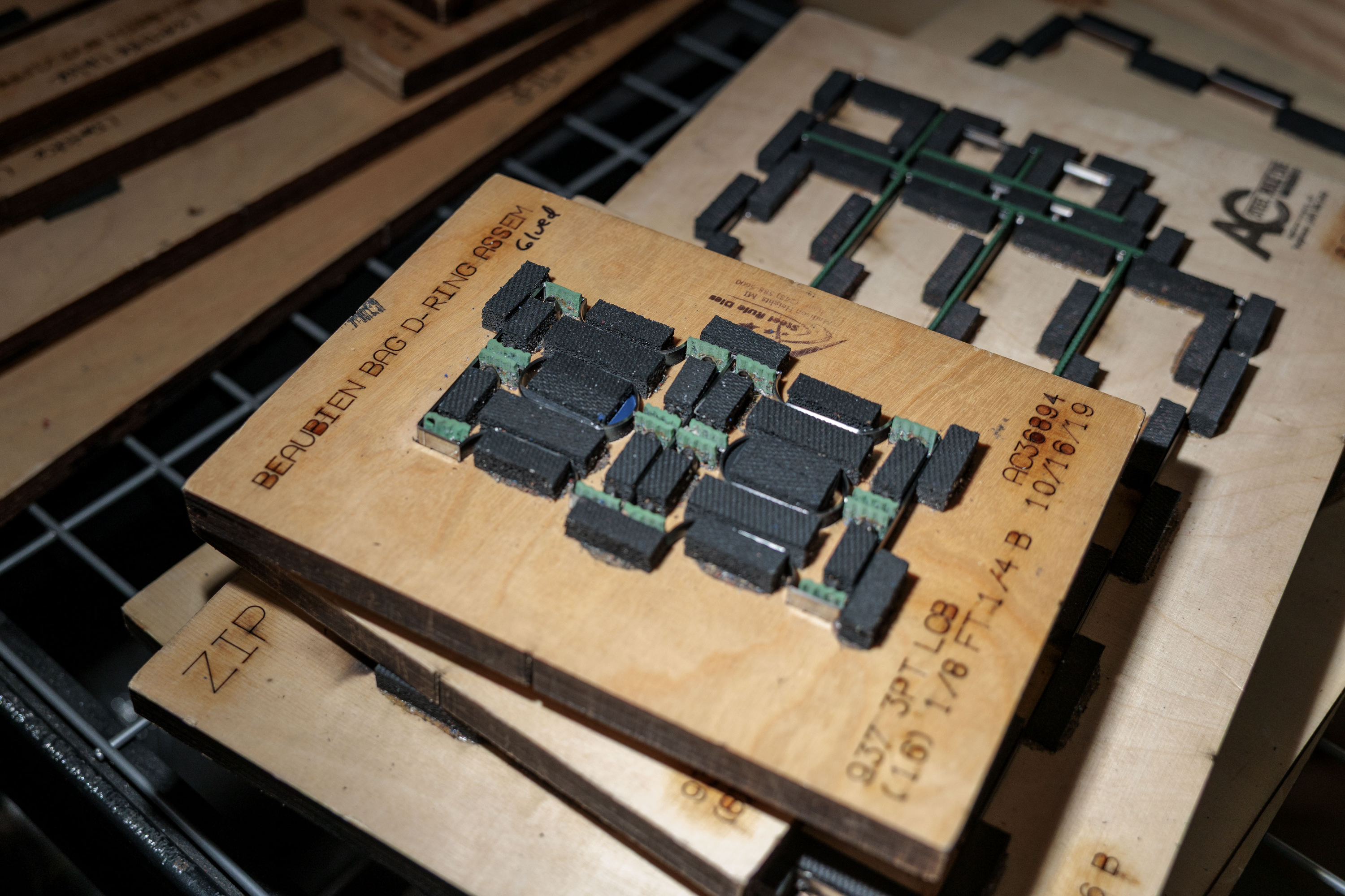 Dies for cut leather pieces to be used in the business’ hydraulic clicker press are stacked on a shelf at Pingree Detroit, 15707 Livernois in Detroit on Monday, Oct. 6 2025.