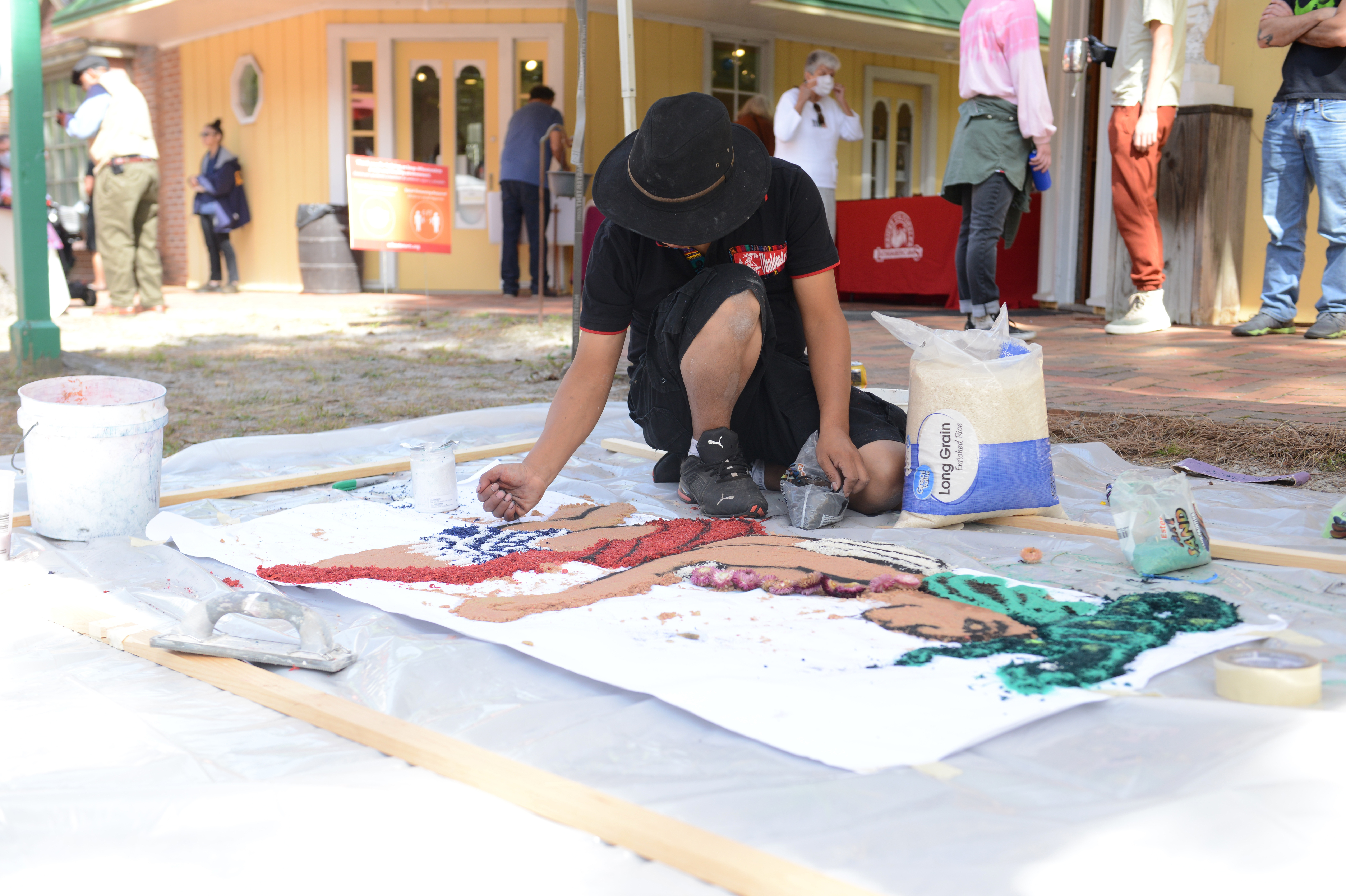 Guatemalan artist Ubaldo Sánchez creates a sawdust carpet during the 22nd annual Festival of Fine Craft at Wheaton Arts in Millville, Saturday, Oct. 2, 2021.