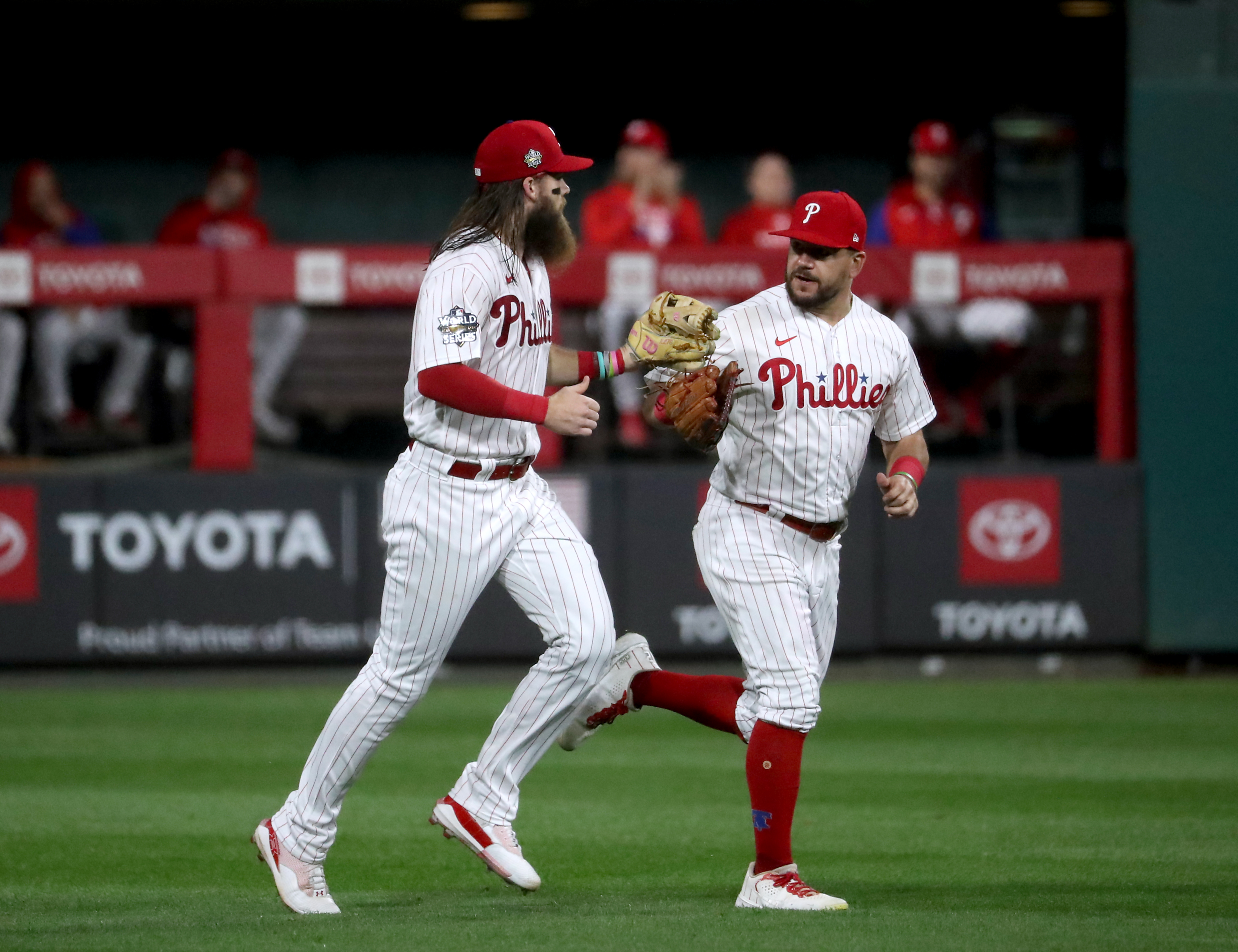 Brandon Marsh (16) and Kyle Schwarber (12) of the Philadelphia Phillies celebrate a catch by Marsh to end the top of the fourth inning during World Series Game 3 against the Houston Astros at Citizens Bank Park, Tuesday, Nov. 1, 2022. 