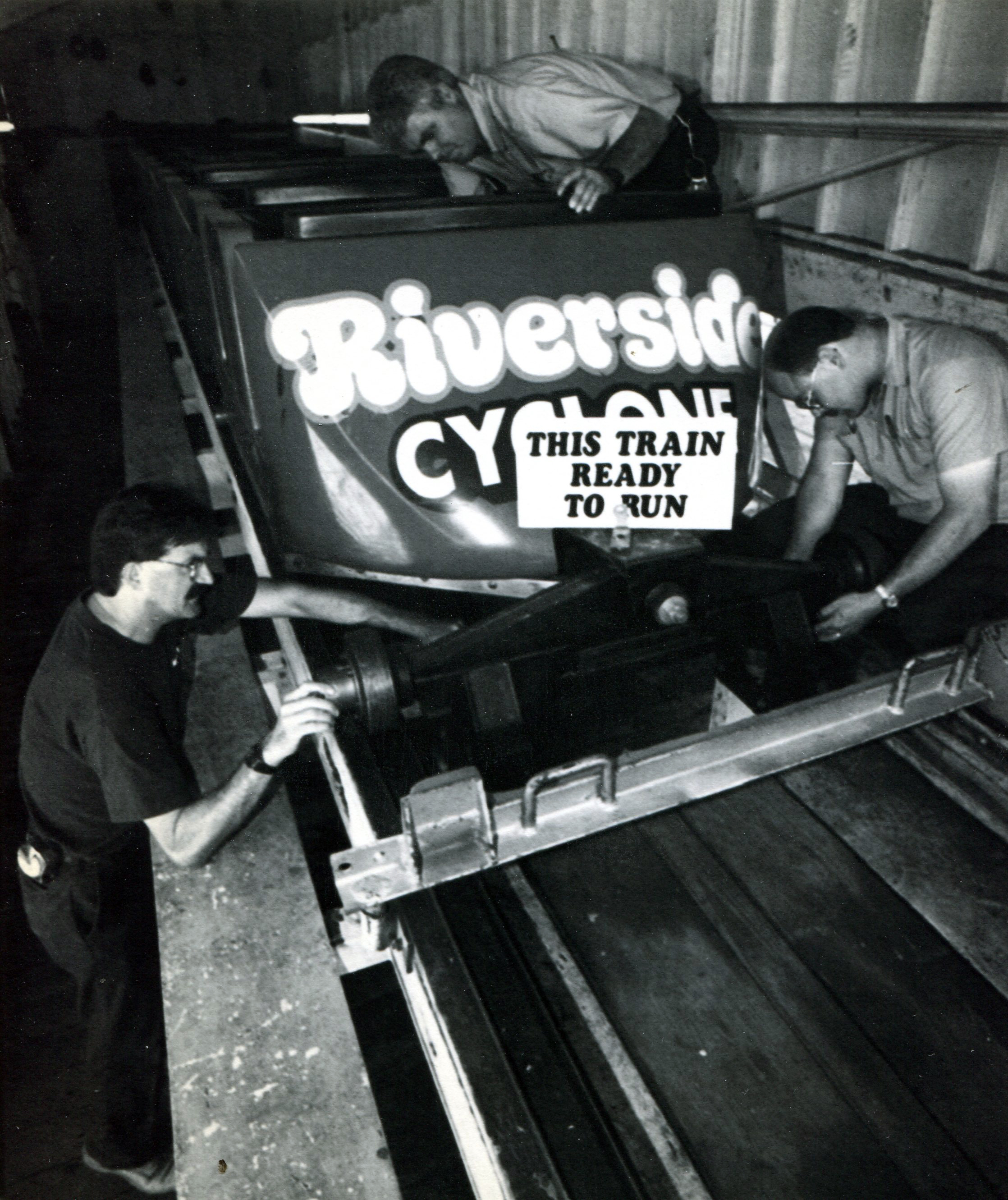 July 6, 1995 - Agawam - From left, Al Morneau, Roch Picard and Don Donahue inspect the lap bar and running gear of one of the trains for the Cyclone at Riverside Park. (Republican file photo) Staff-Shot