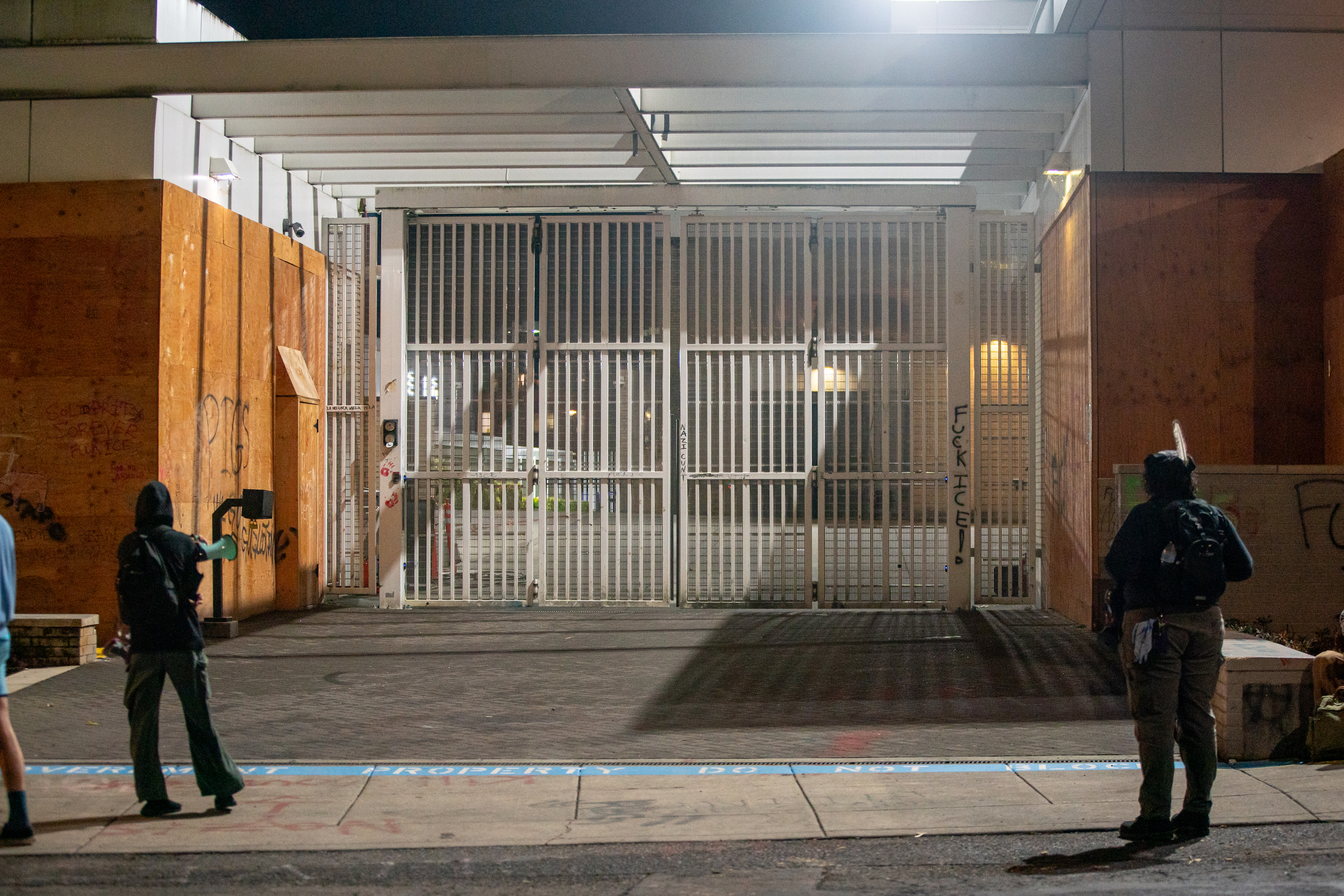 Protesters gather outside the boarded-up U.S. Immigration and Customs Enforcement building in South Portland on Monday, Sept. 8, 2025, days after President Donald Trump suggested federal intervention.