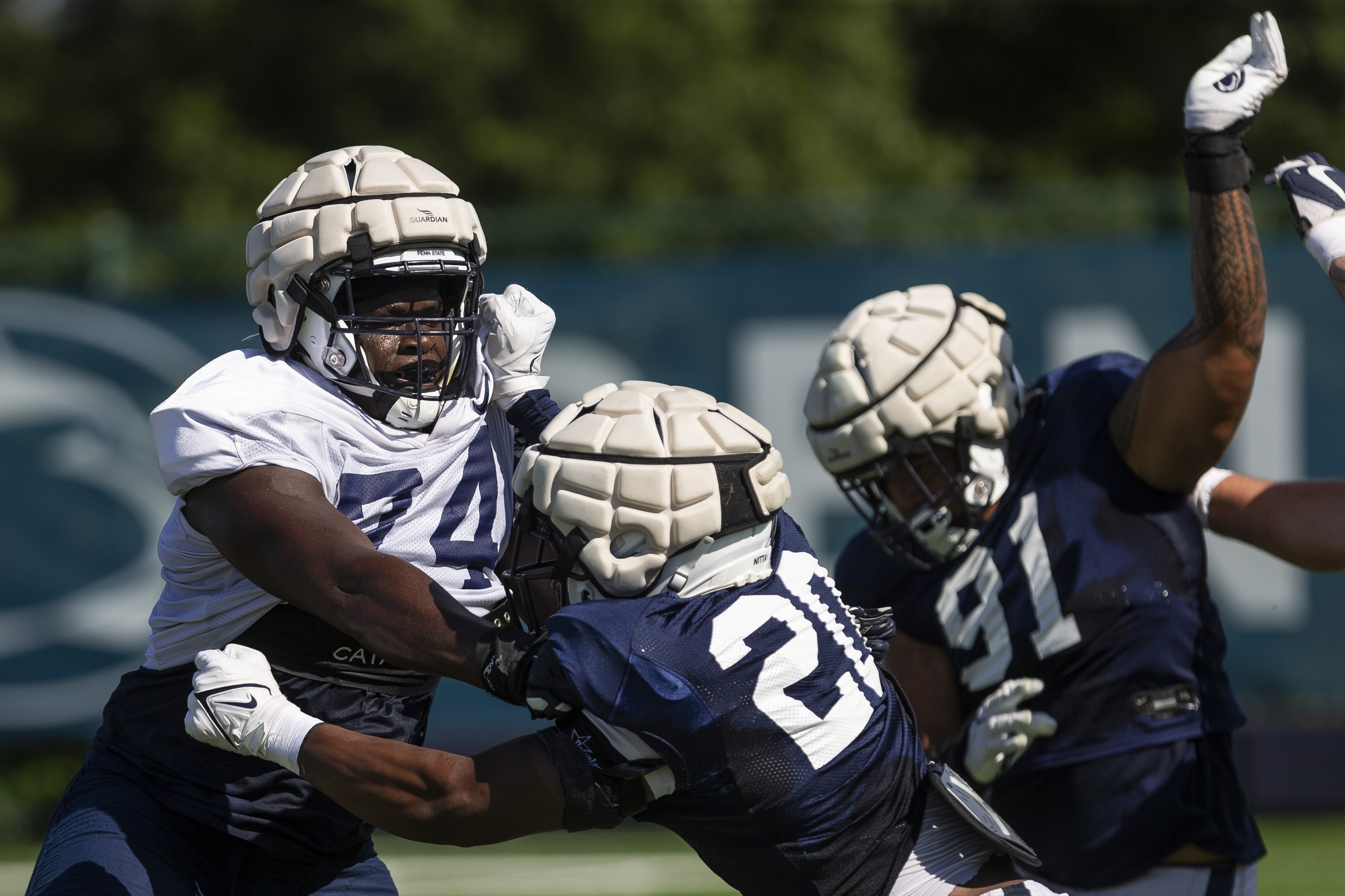 Penn State defensive lineman Arnold Ebiketie catches a pass during