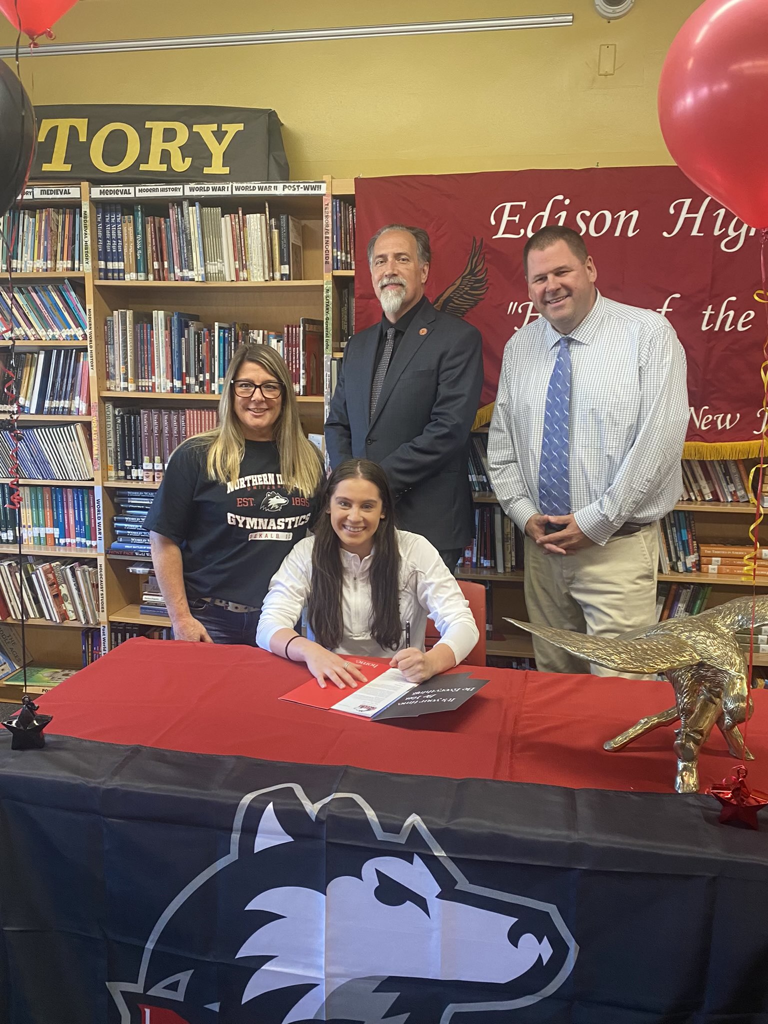Edison's Haley Zampella signed to continue her gymnastics career at Northern Illinois with left to right, Coach Leanne Salvatore, Principal Charles Ross,  and Athletic Director Dave Sandaal.
