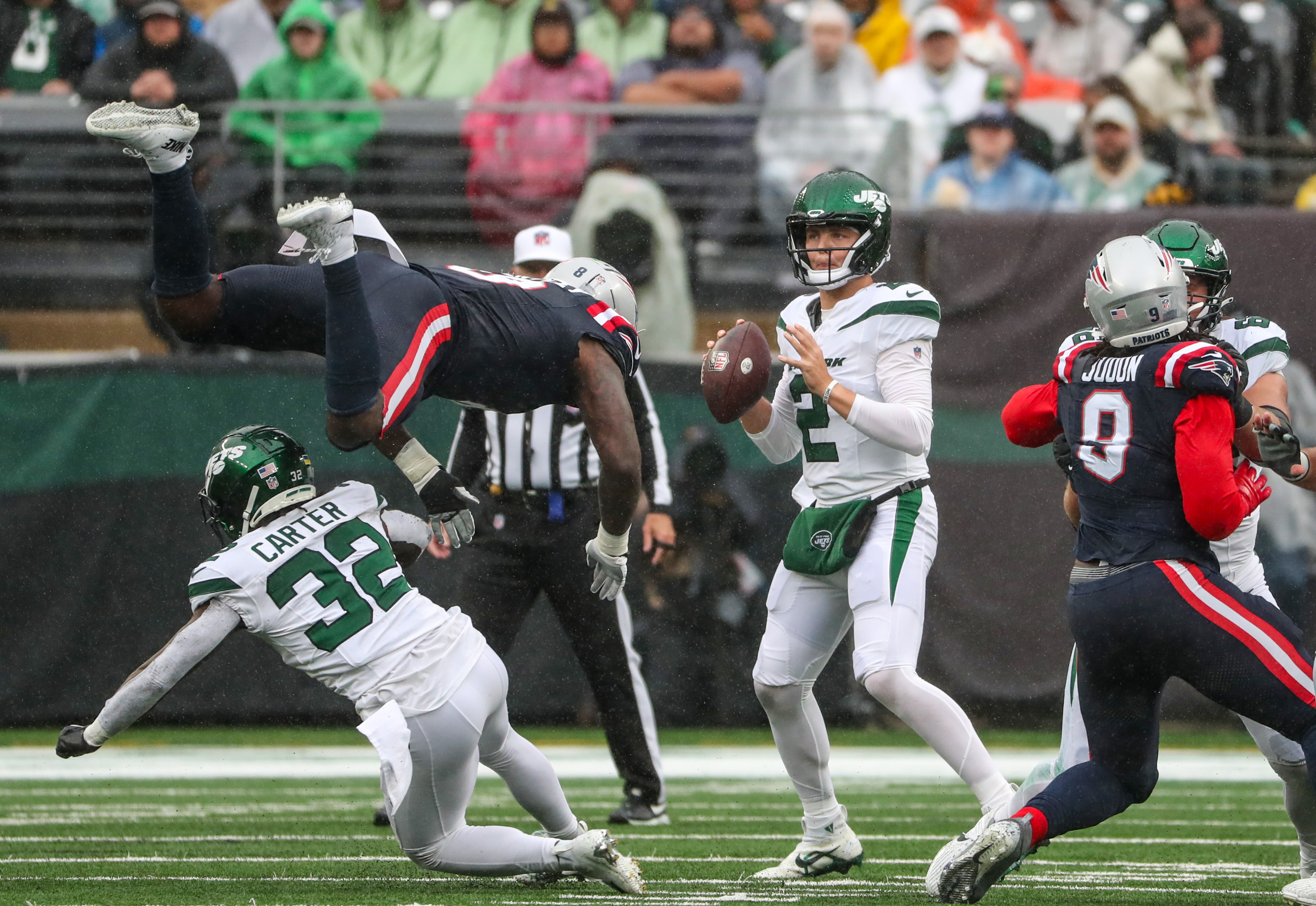 New York Jets running back Michael Carter (32) is tackled during