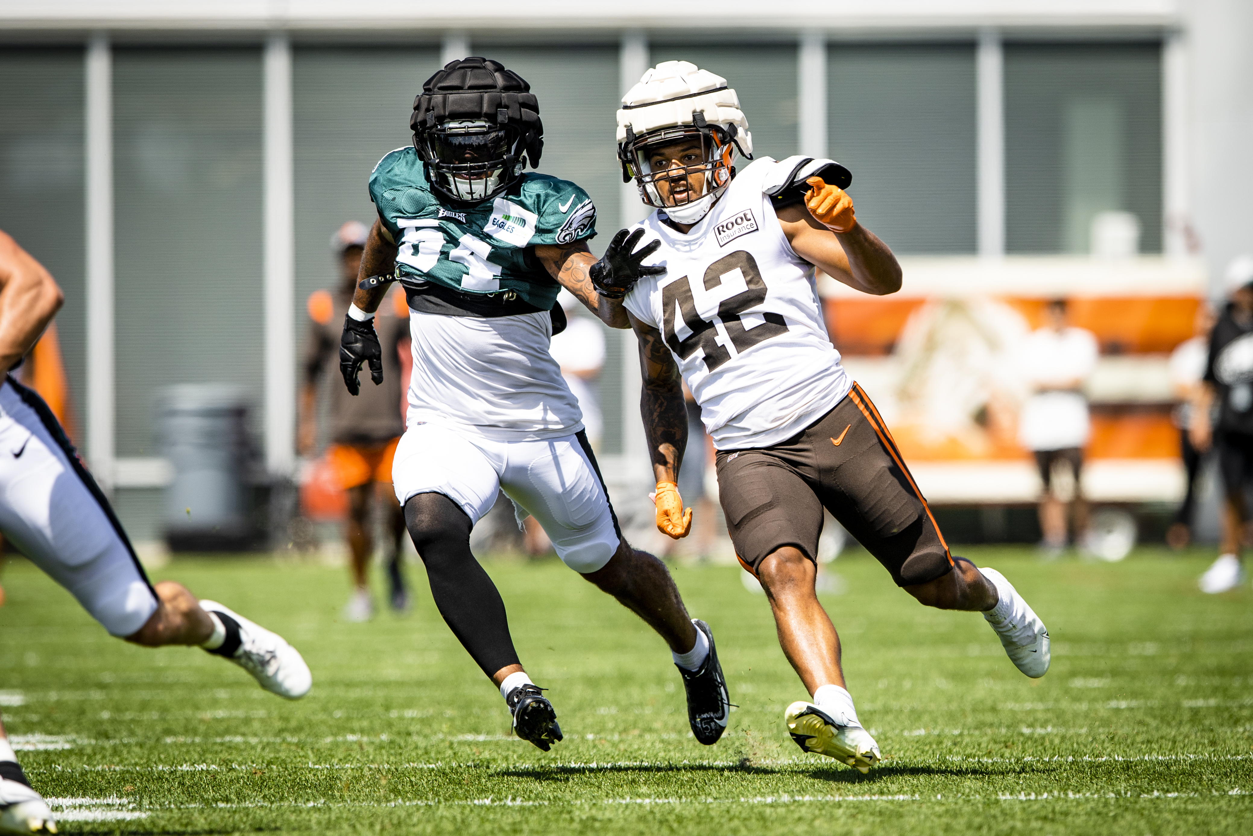 Cleveland Browns linebacker Tony Fields II (42) and cornerback