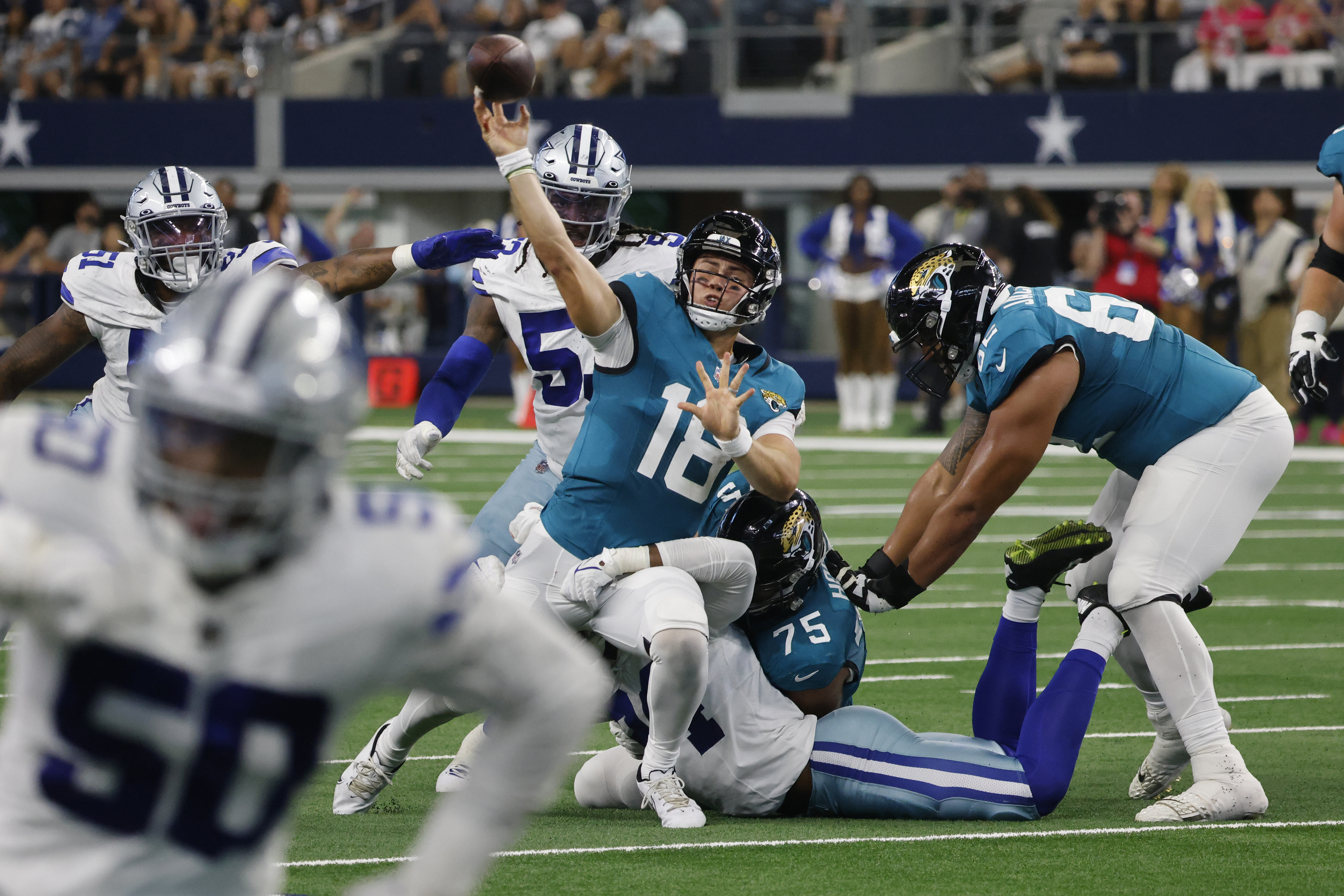 Jacksonville Jaguars quarterback C.J. Beathard (3) scores during the first  half of an NFL preseason football game against the Dallas Cowboys,  Saturday, Aug. 12, 2023, in Arlington, Texas. (AP Photo/Michael Ainsworth  Stock