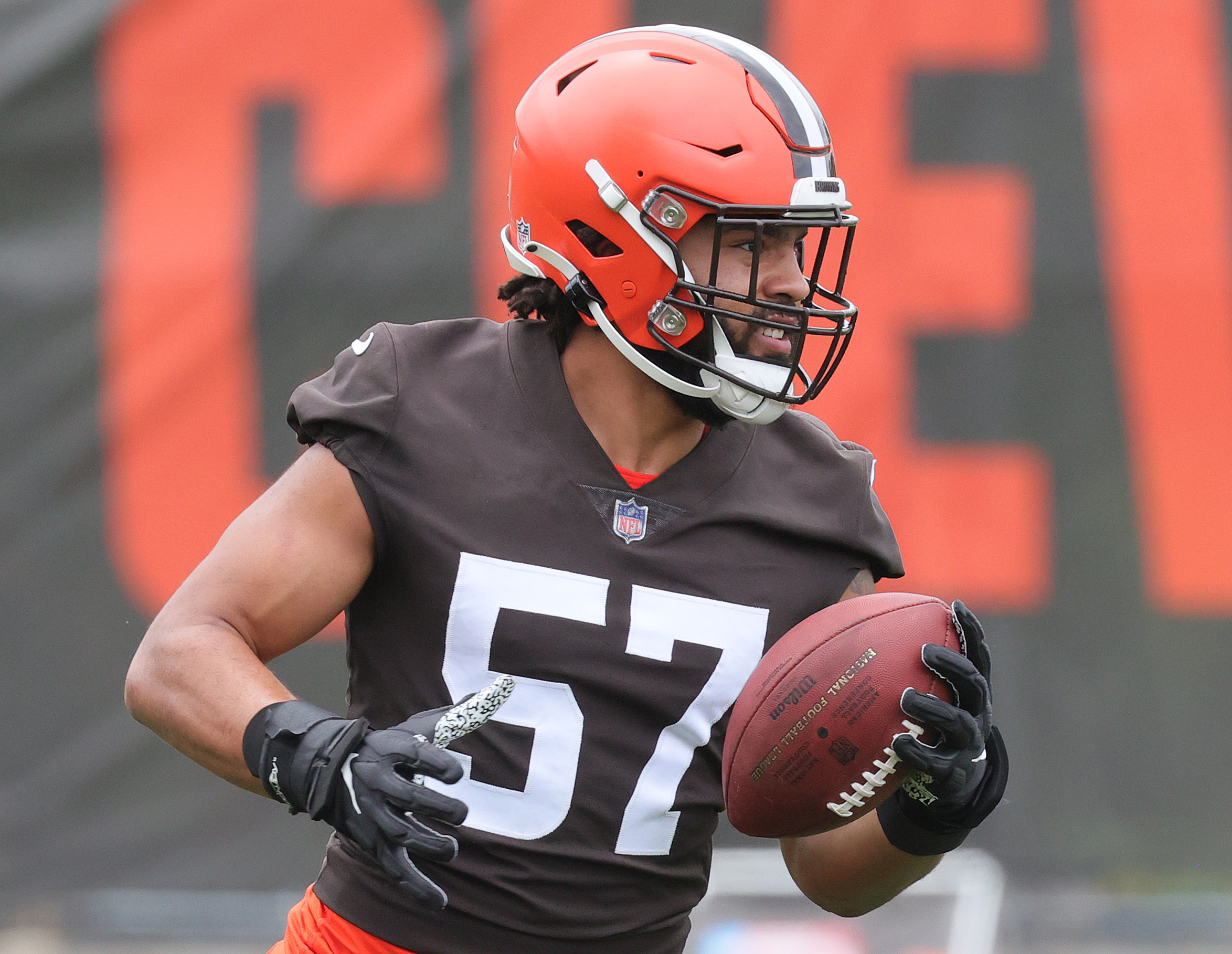 Cleveland Browns defensive end Romeo McKnight (57) runs off of the