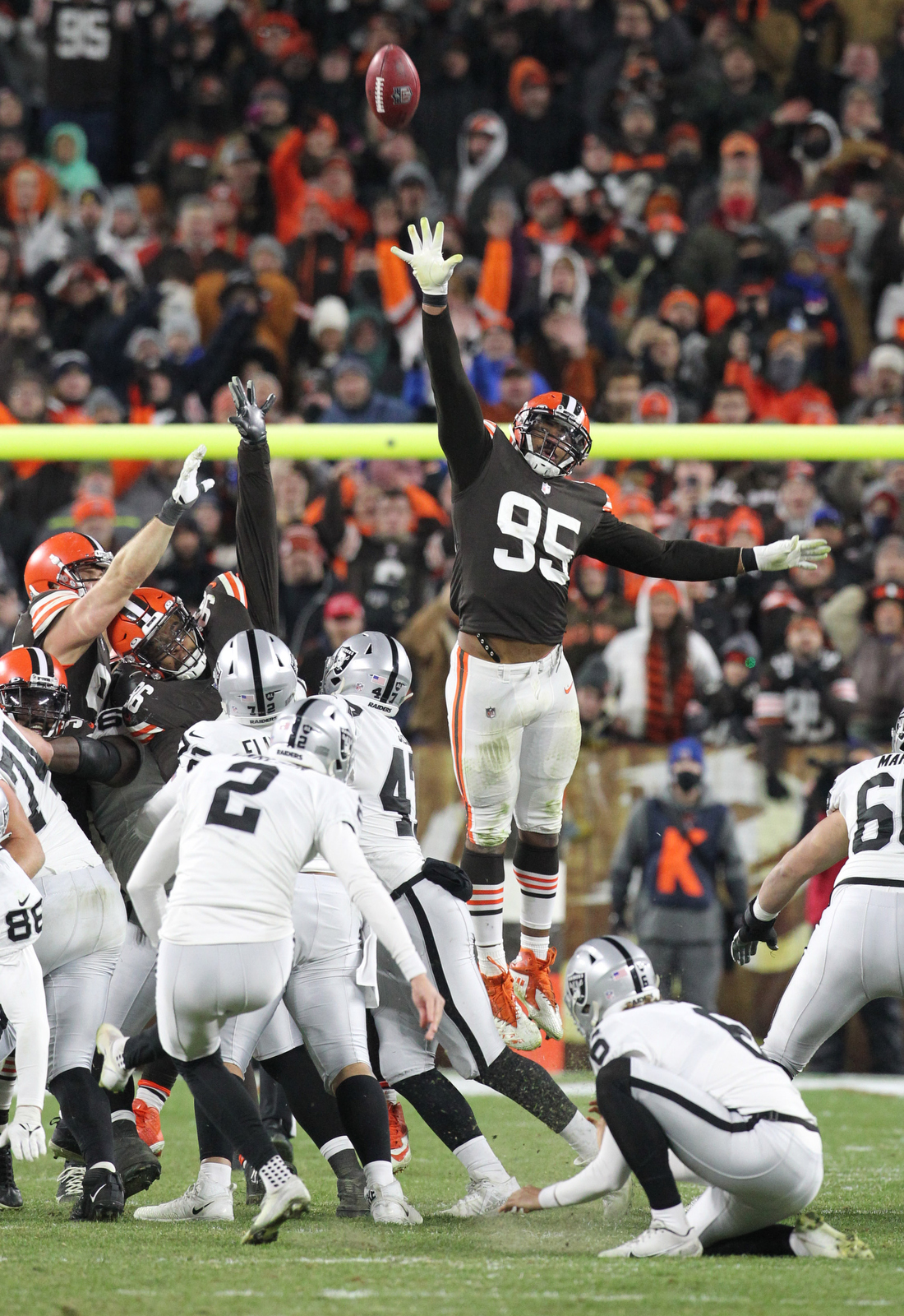 Cleveland Browns defensive end Porter Gustin (97) warms up next to