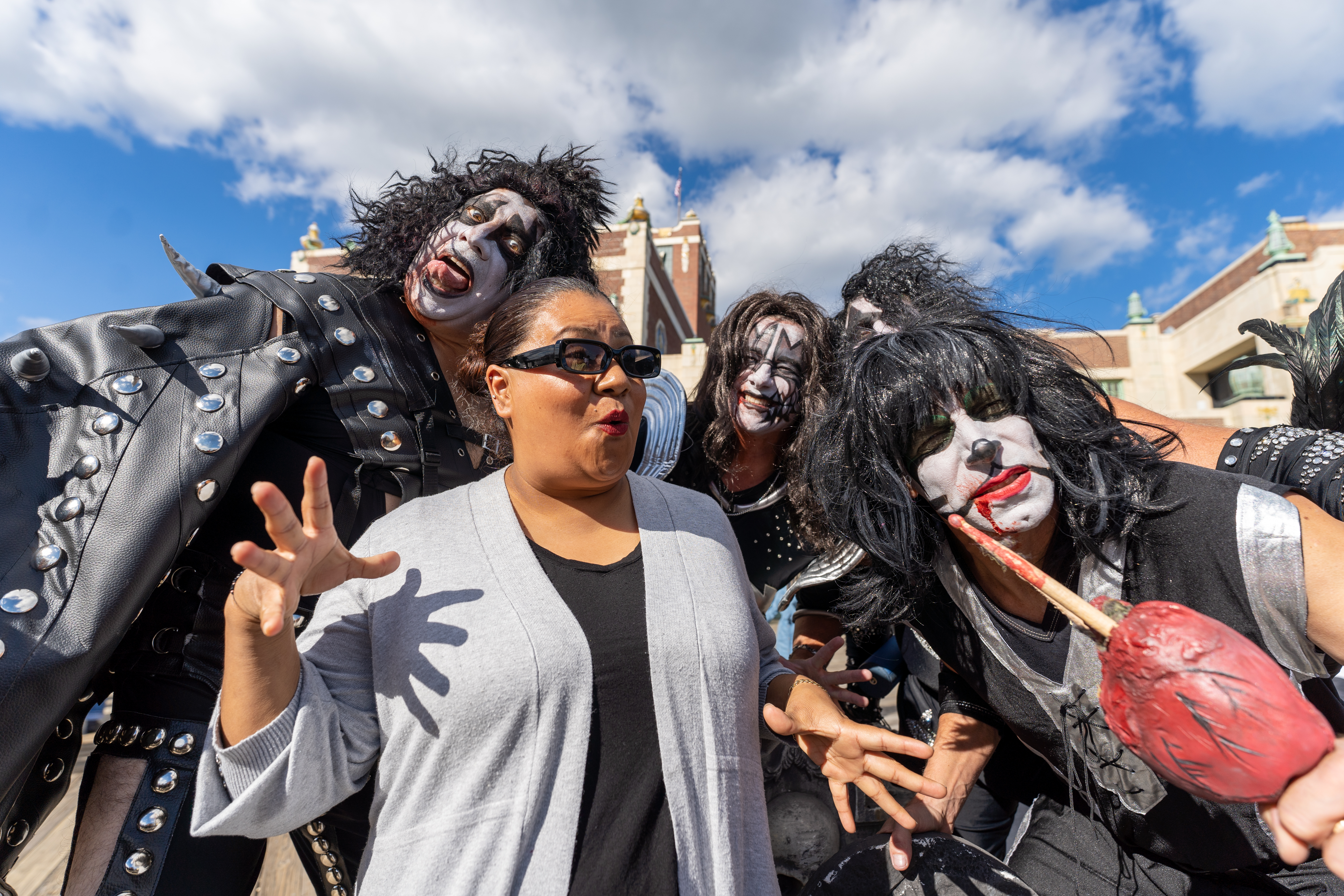 Carmen Paza, middle, poses for a photograph with zombie KISS during  the 14th Asbury Park Zombie Walk in Asbury Park on Saturday, October 8, 2022. The zombie walk held its first themed year with the theme being 80's and 90's punk and metal.