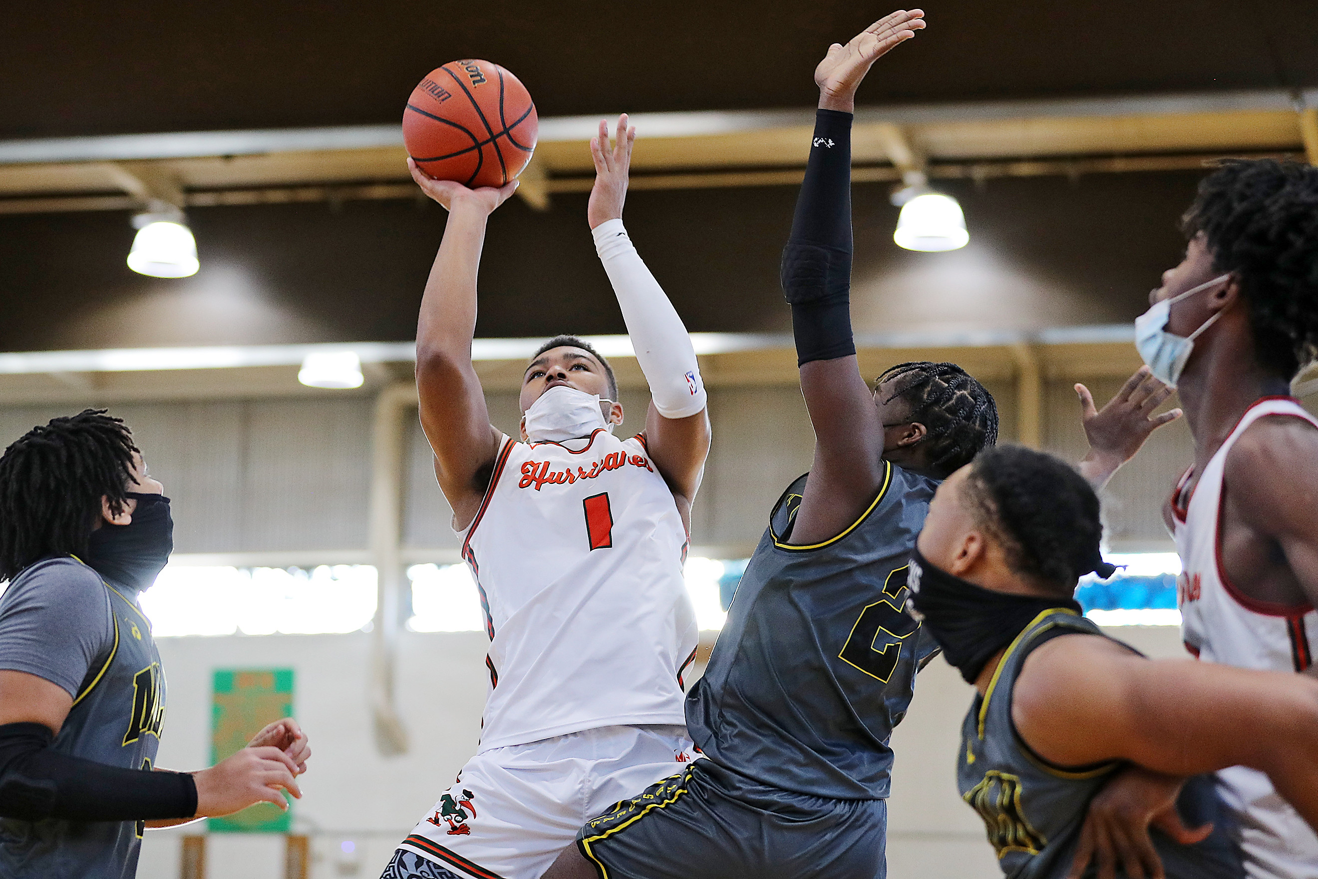 Photos of Detroit Douglass basketball player Pierre Brooks II